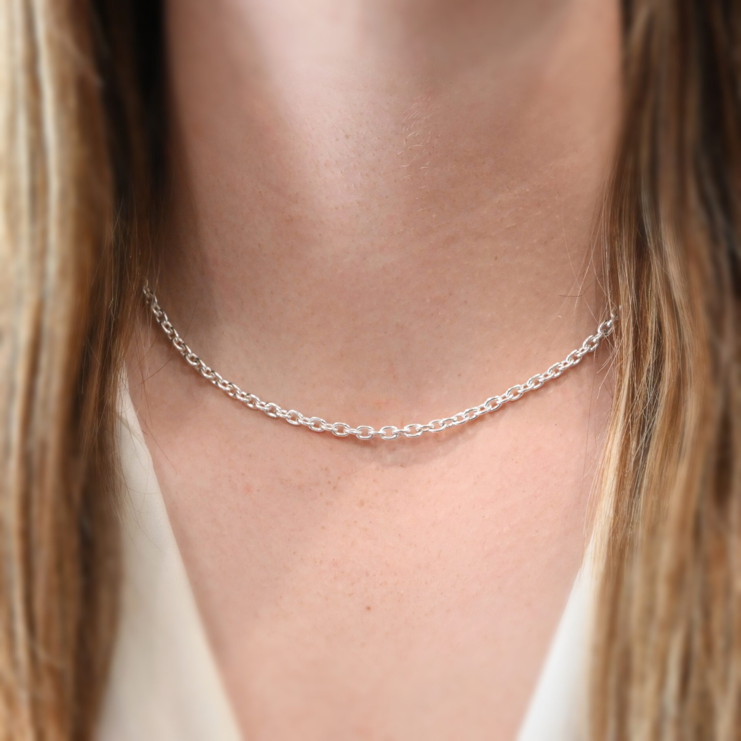 Lauren Chain - 16-19", Shiny shown on model with white shirt and brown hair