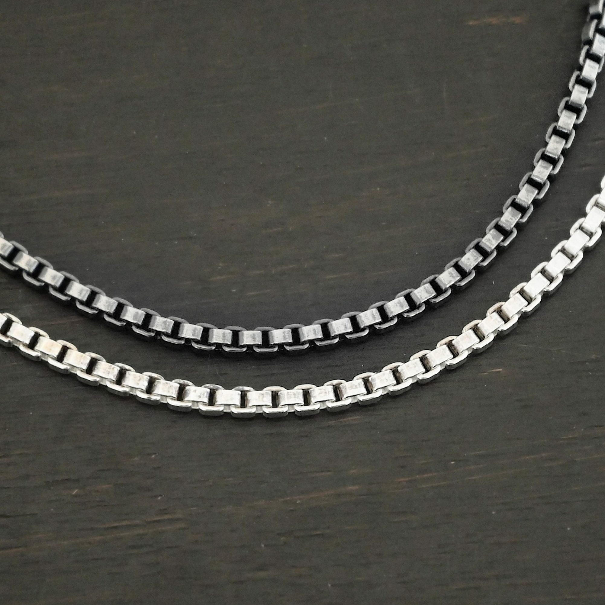 Sterling Silver shiny & oxidized Briggs Box Chain on dark background