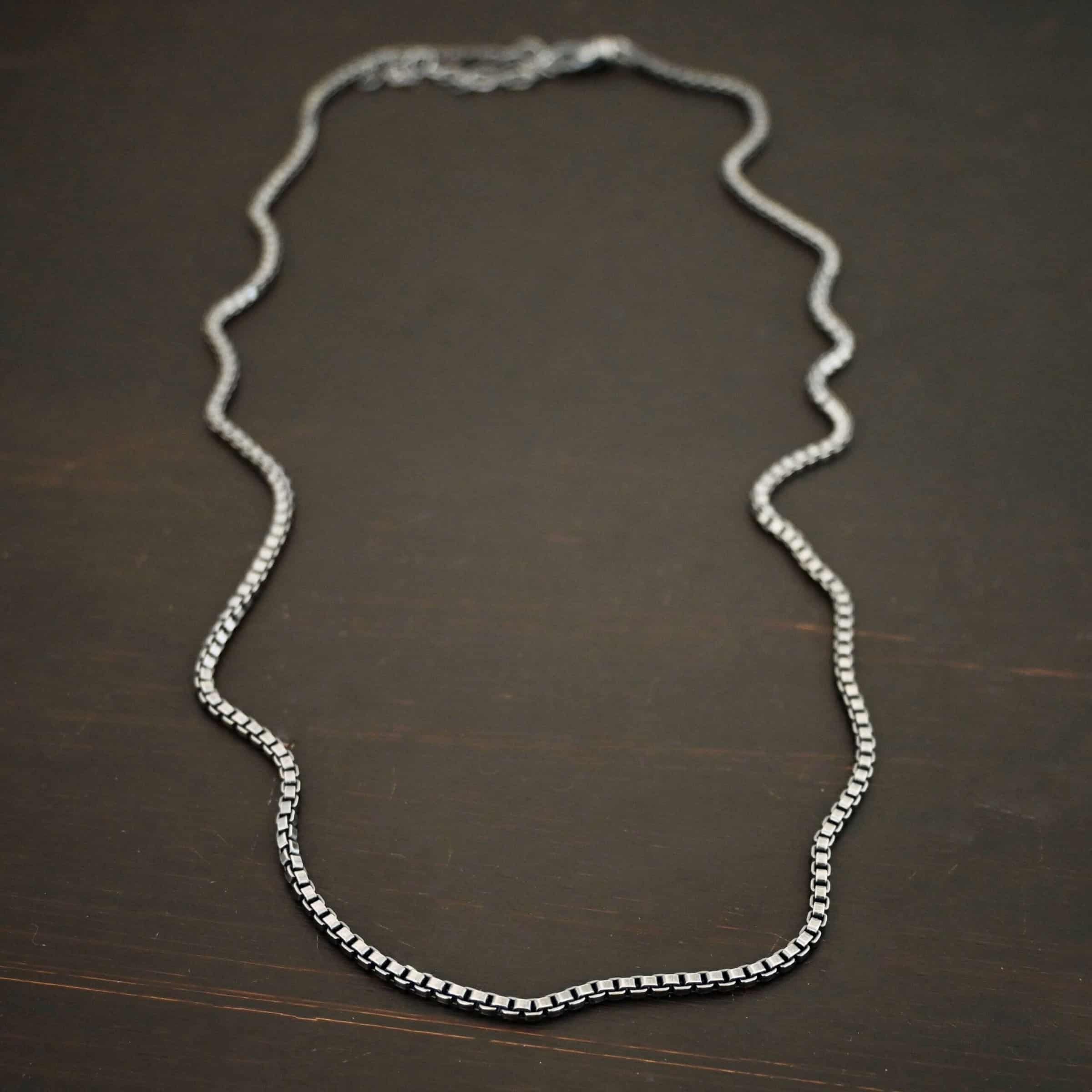 Sterling Silver oxidized Briggs Box Chain on dark background