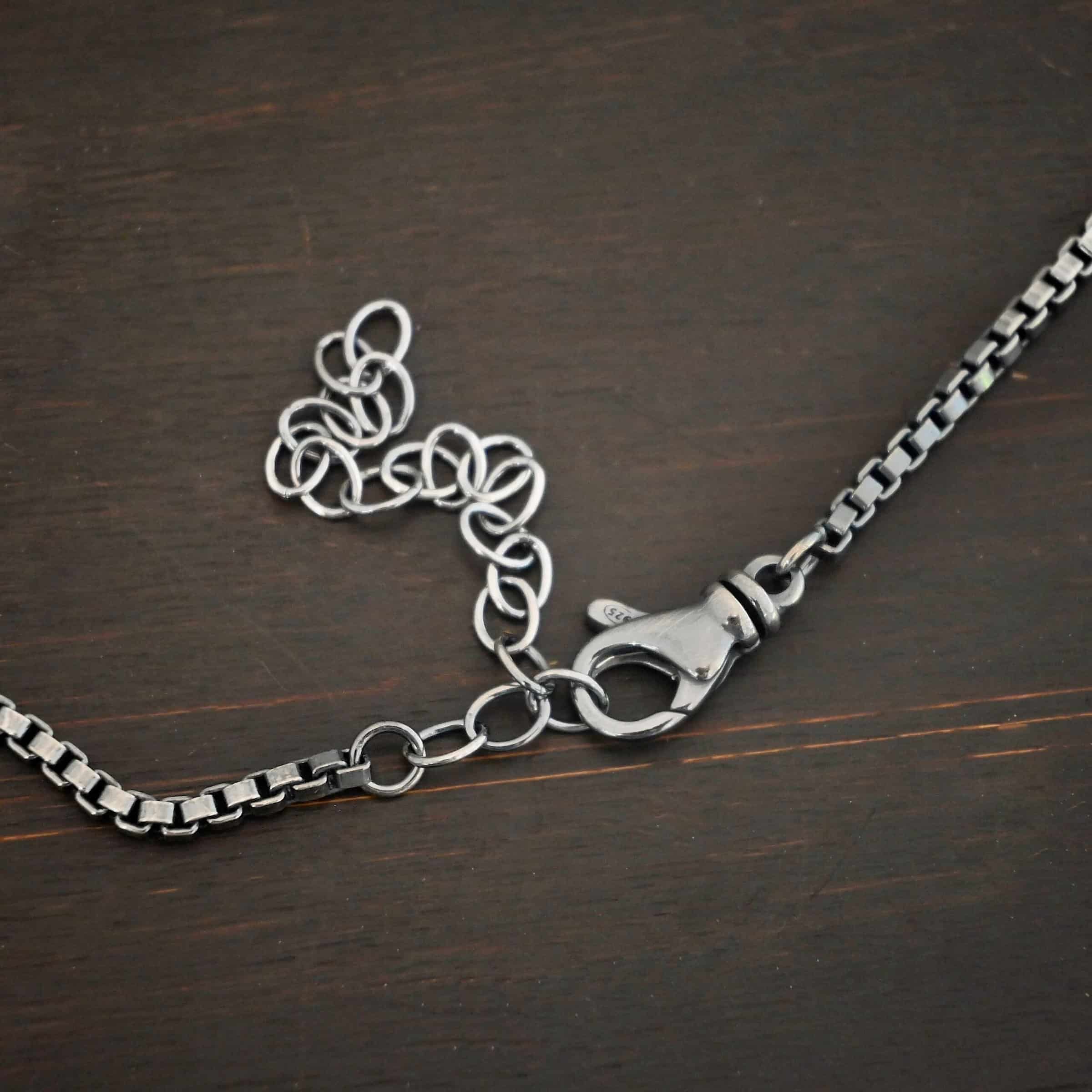 Sterling Silver oxidized Briggs Box Chain on dark background