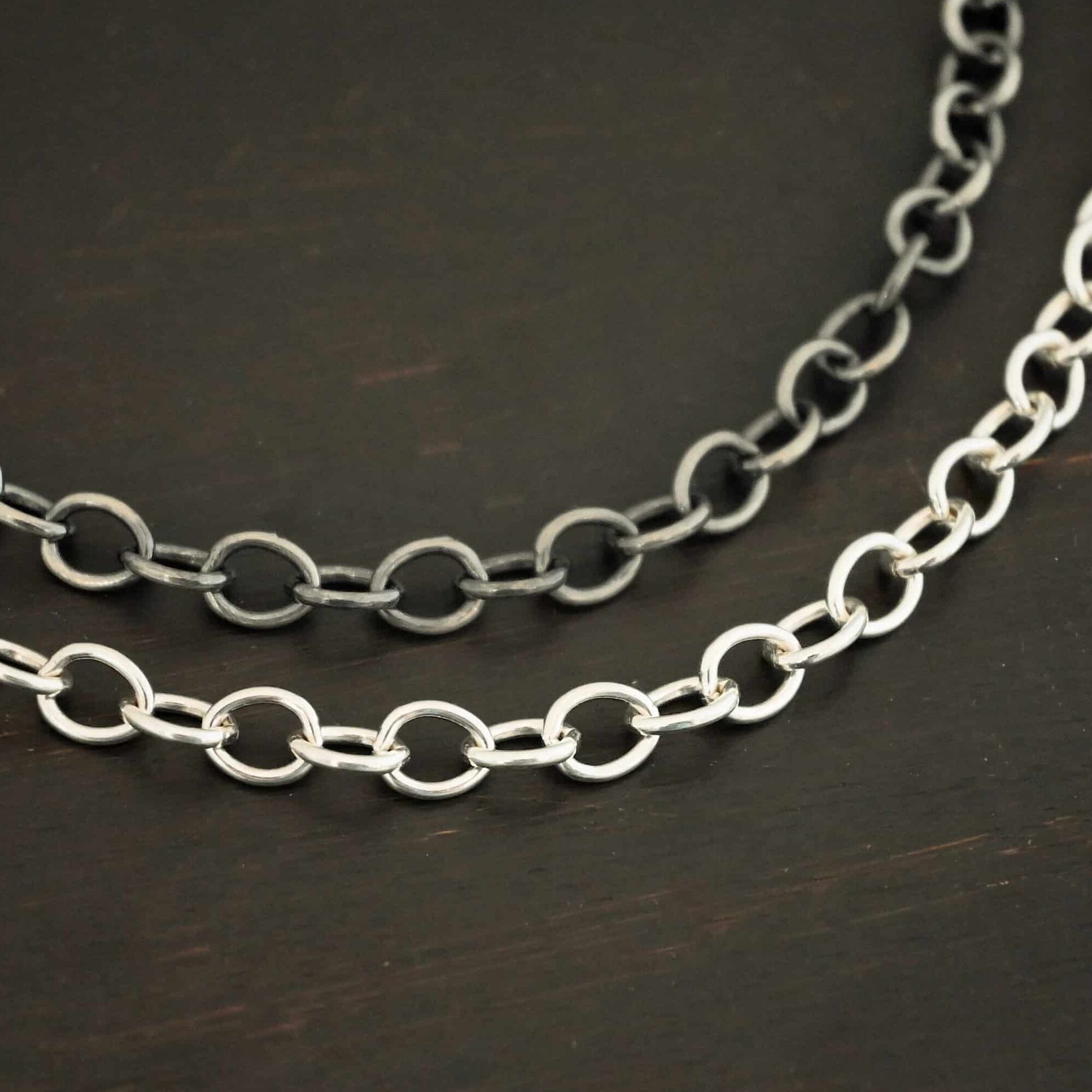 Sterling Silver Jay chain shown shiny & oxidized on dark background