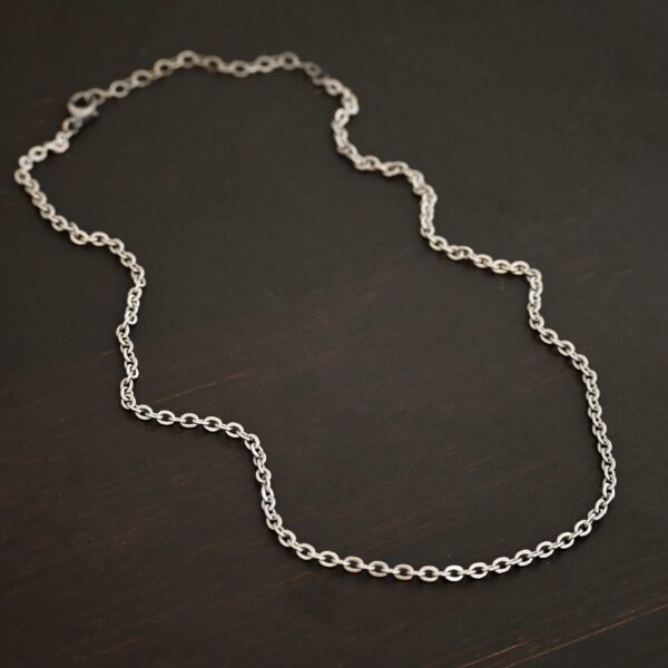 Stainless Steel Simon Chain shown on dark background