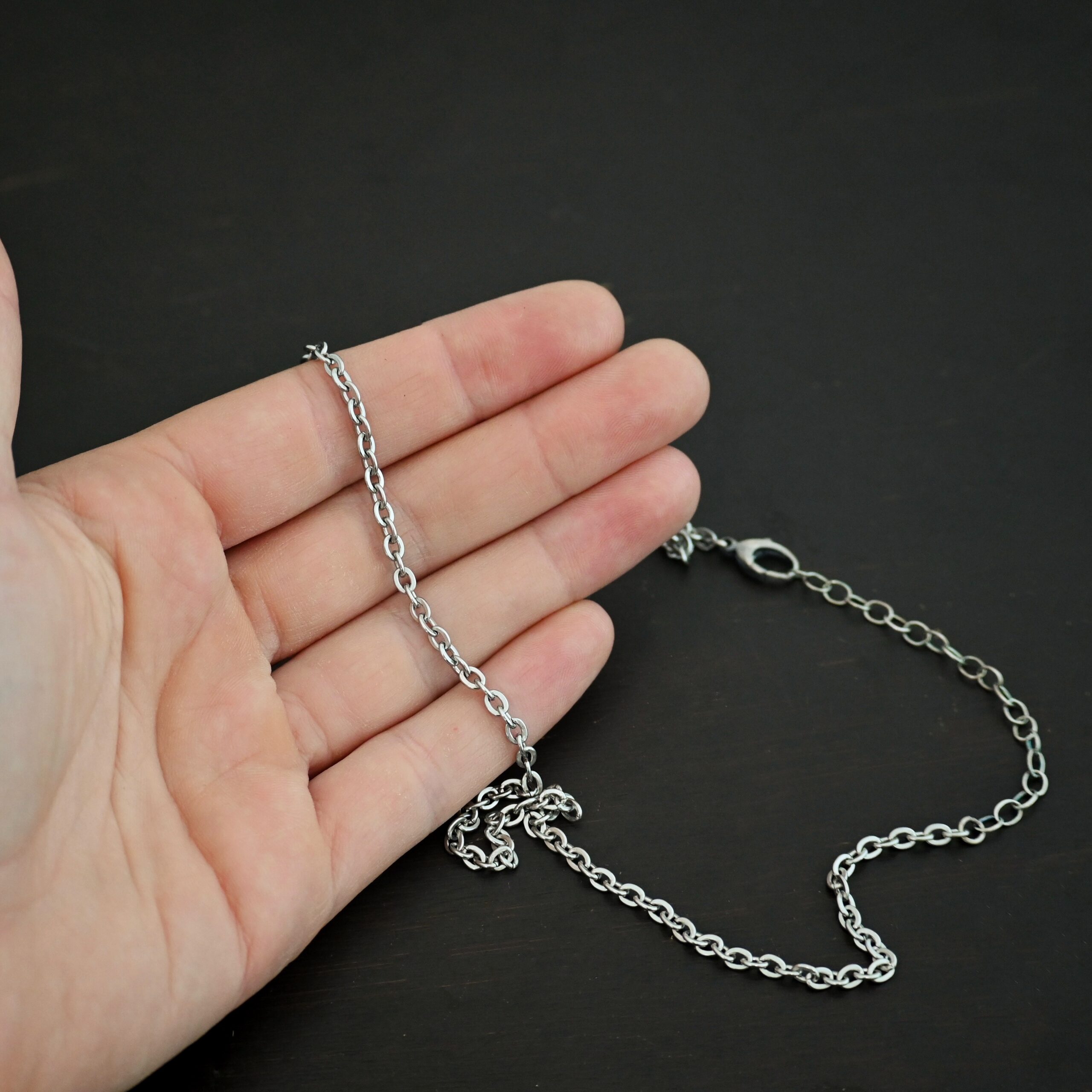 Stainless Steel Simon Chain shown in hand