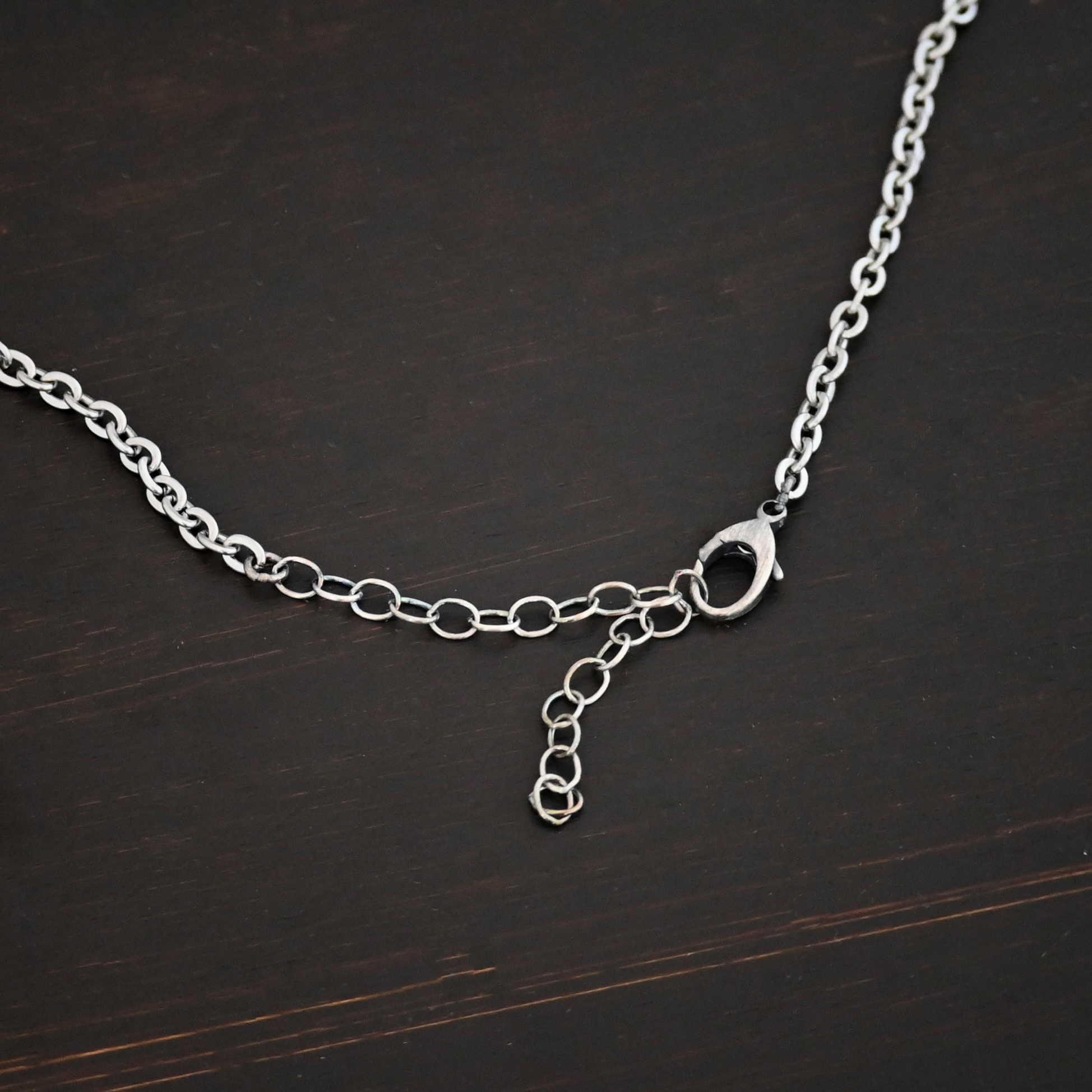 Stainless Steel Simon Chain shown on dark background