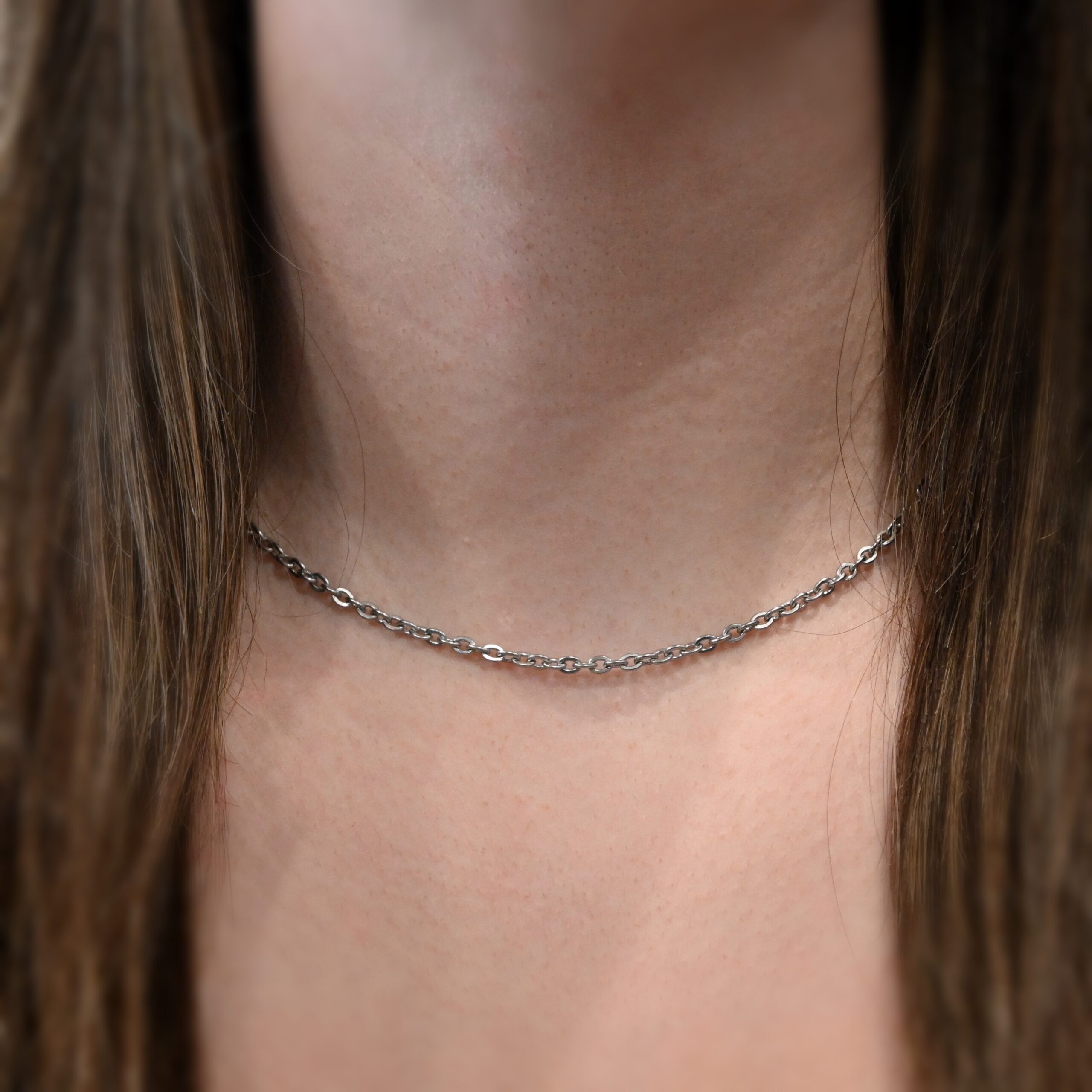 Stainless Steel Simon Chain 16-19" shown on model with white shirt and brown hair