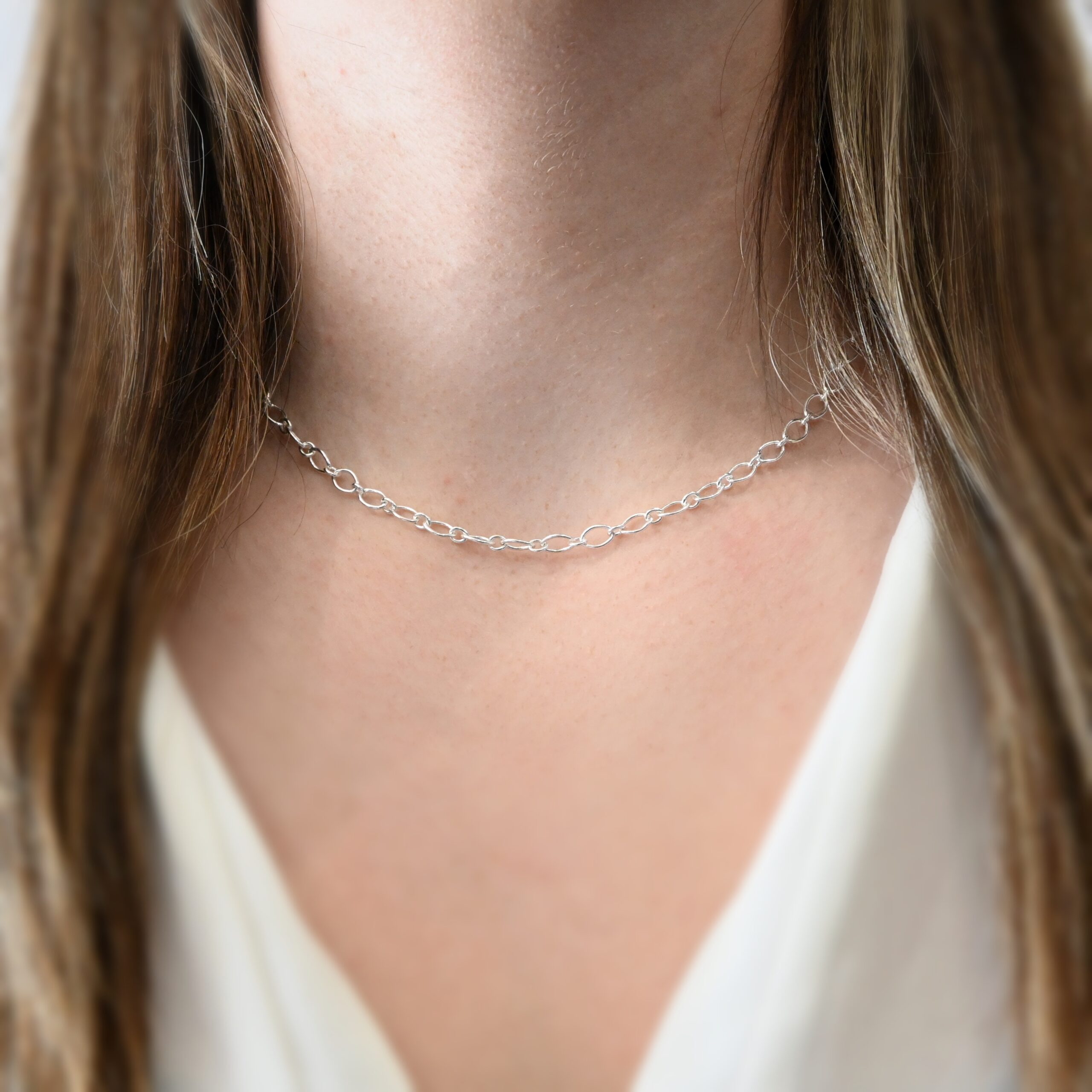 Allie Chain - 16" Shiny shown on model with white shirt and brown hair