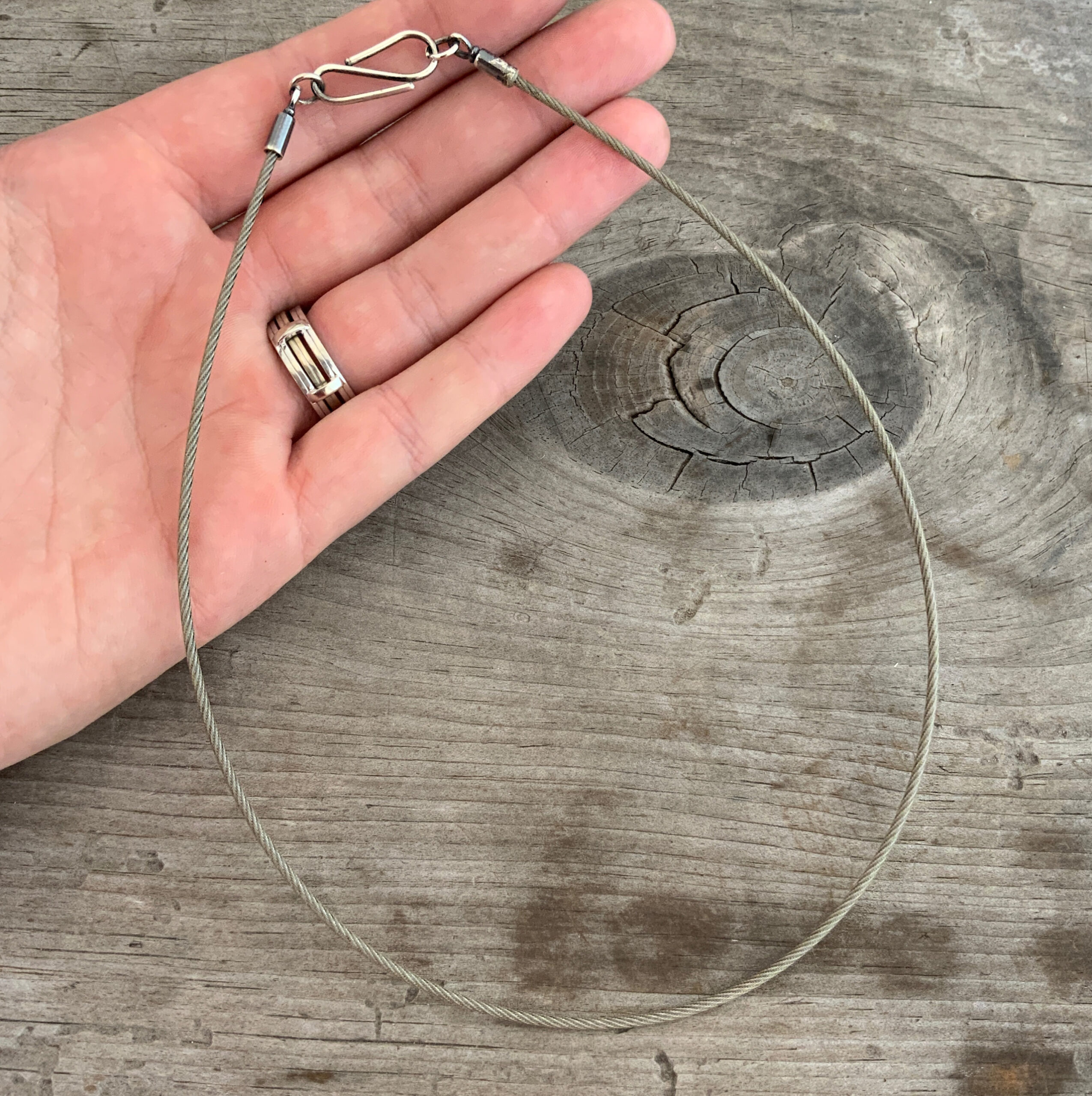 Sawyer Steel Wire Necklace shown in hand