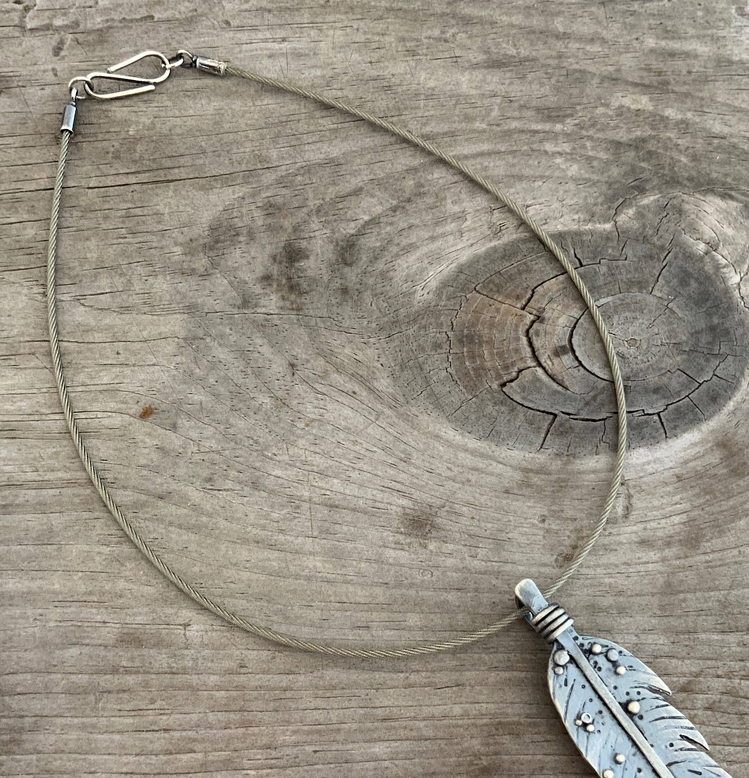 Sawyer Steel Wire Necklace shown on wood background