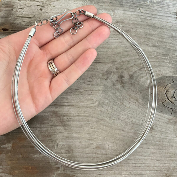 Susanna Stainless Necklace shown in hand