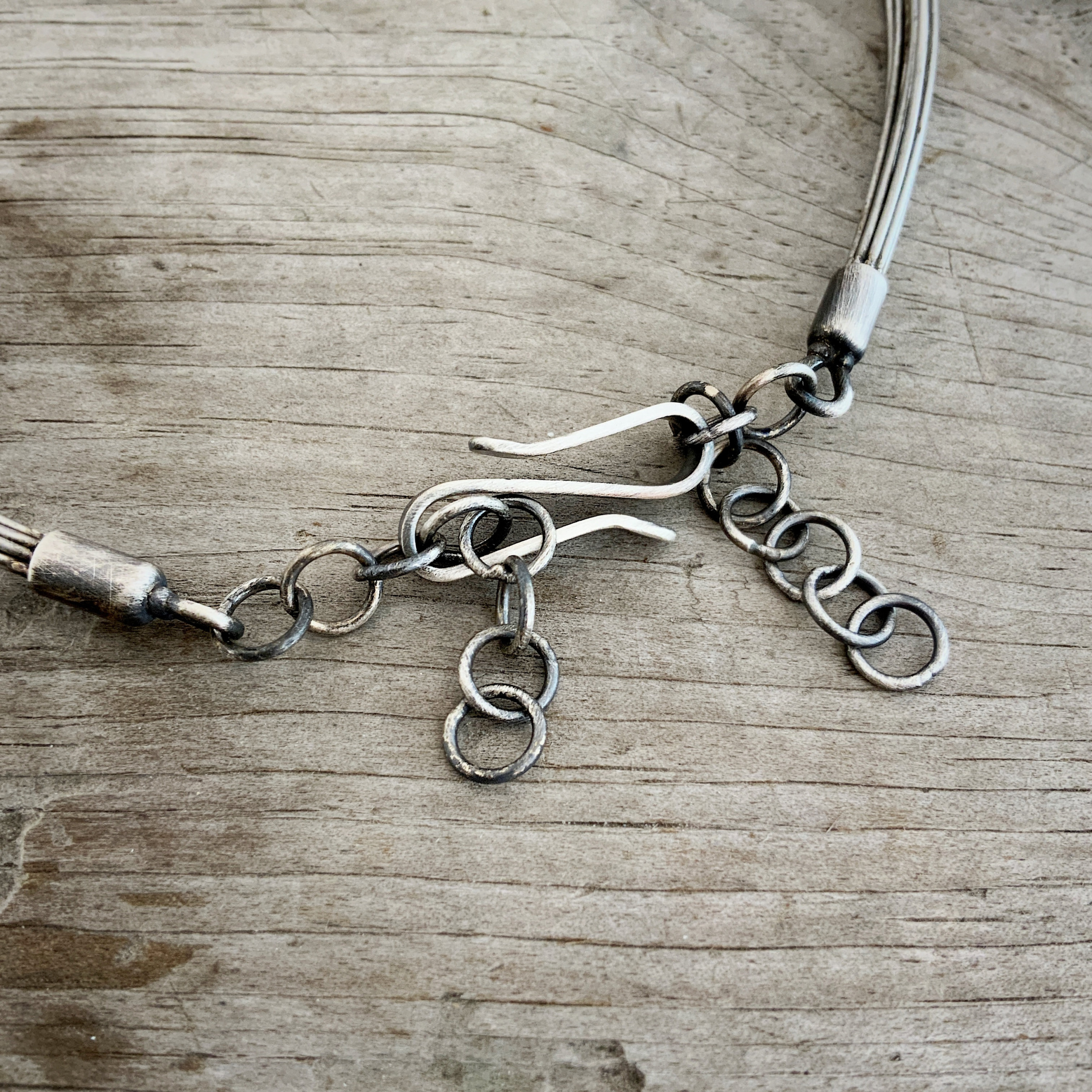 Susanna Stainless Necklace Susanna Stainless Necklace shown on wood background