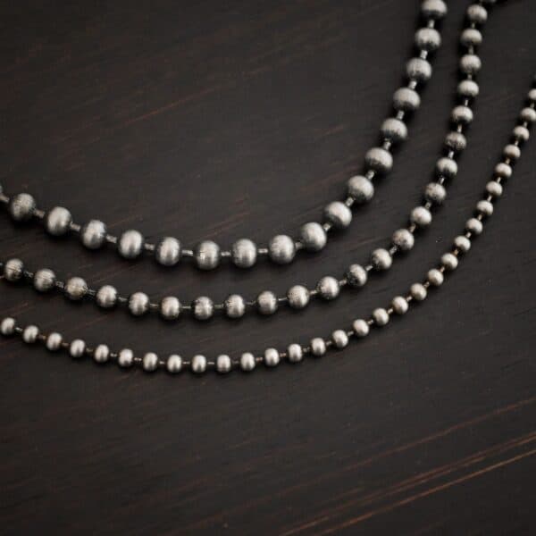 Stainless Steel Beau Ball chain shown on dark background