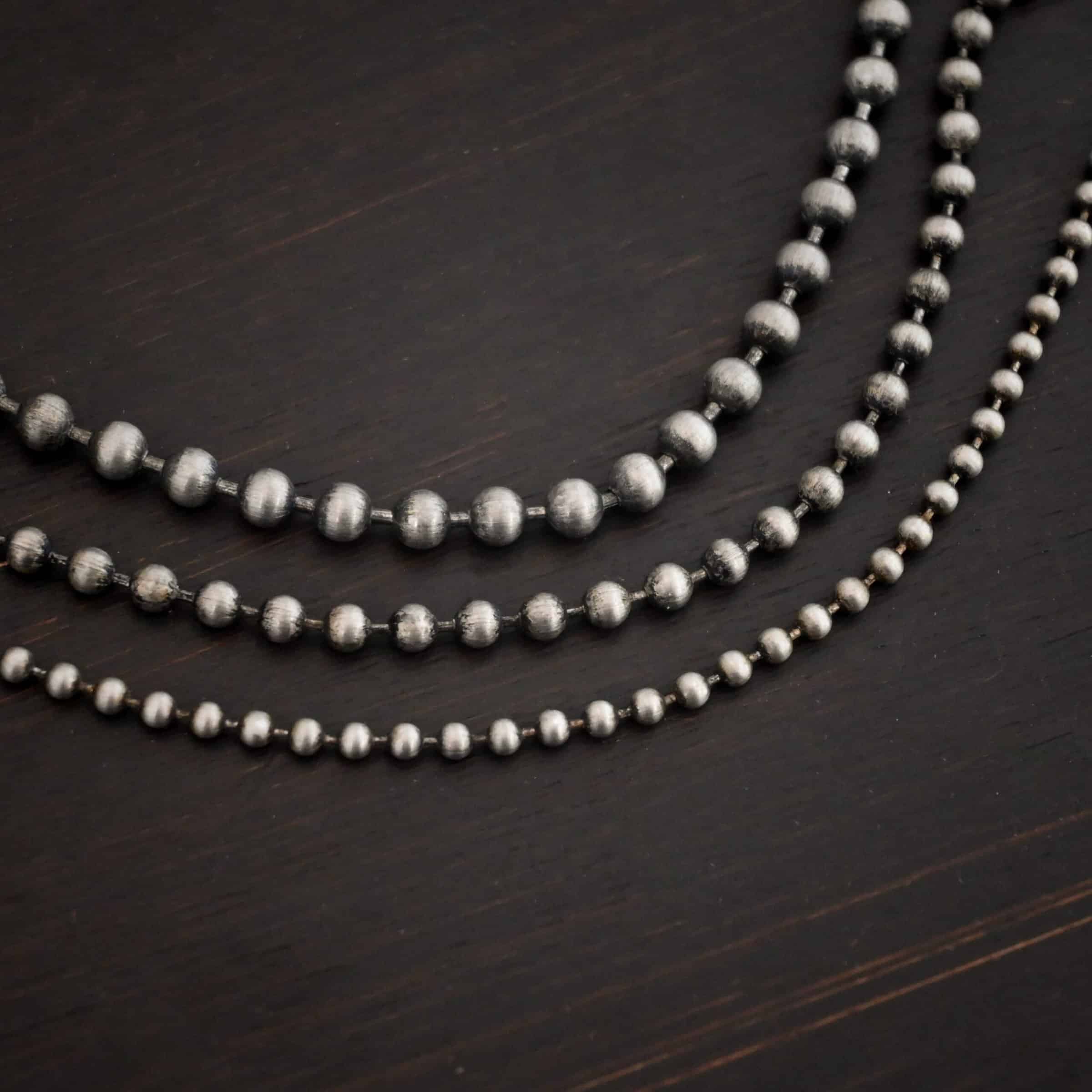 Stainless Steel Beau Ball chain shown on dark background