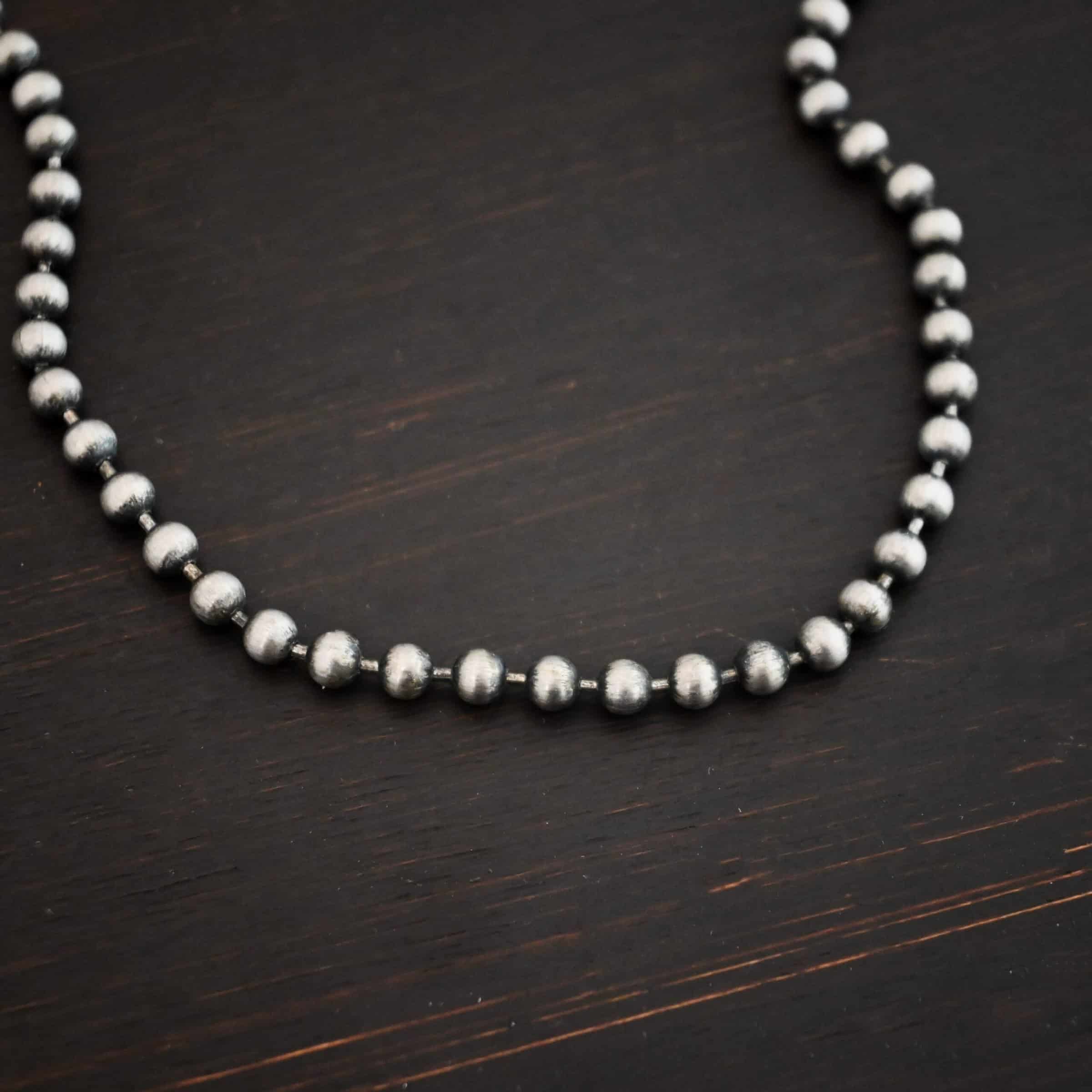 Stainless Steel Beau Ball chain shown on dark background