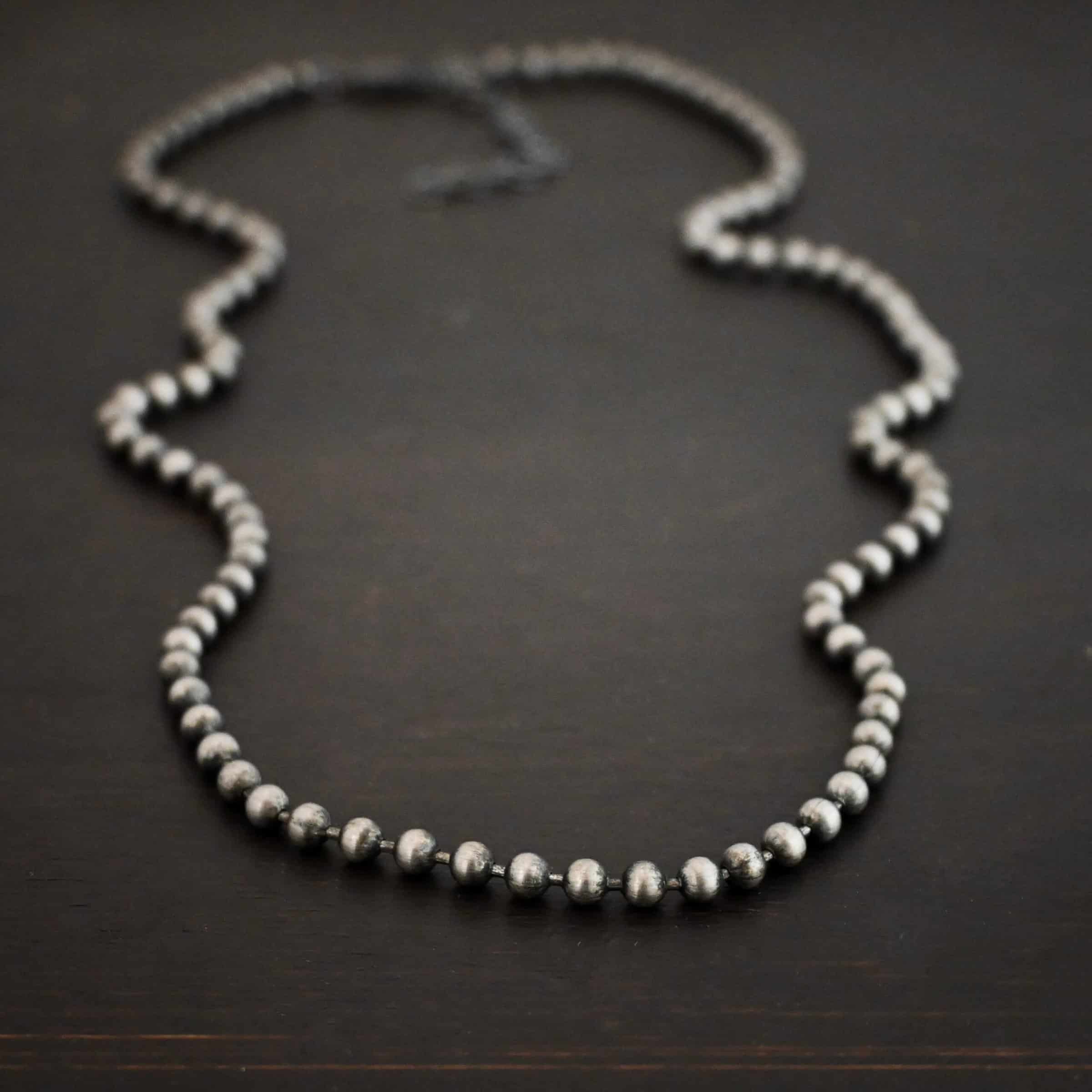 Stainless Steel Beau Ball chain shown on dark background
