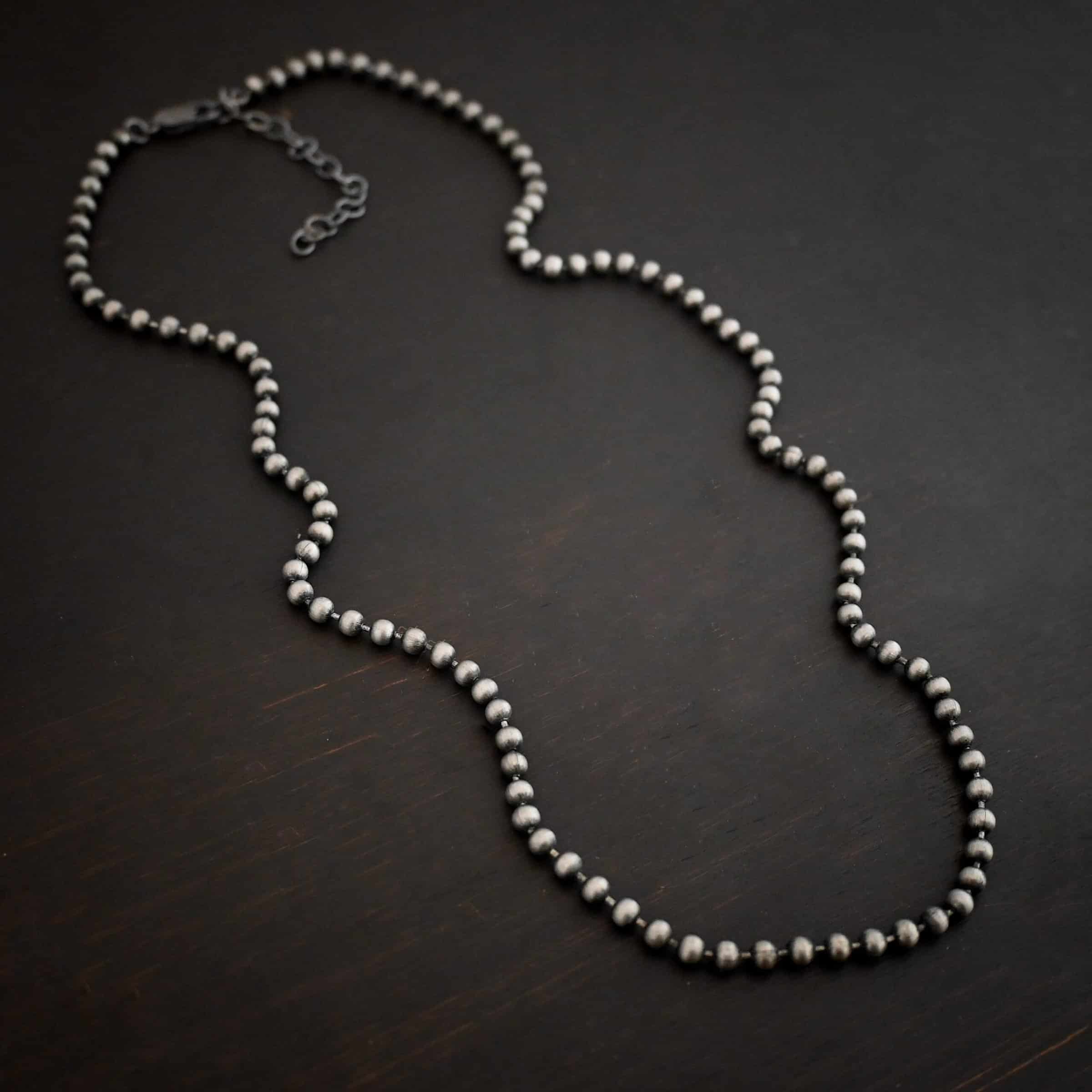 Stainless Steel Beau Ball chain shown on dark background