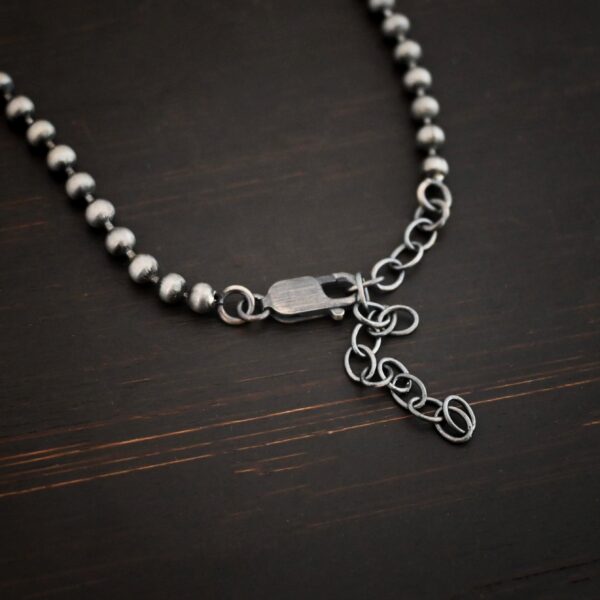 Stainless Steel Beau Ball chain shown on dark background