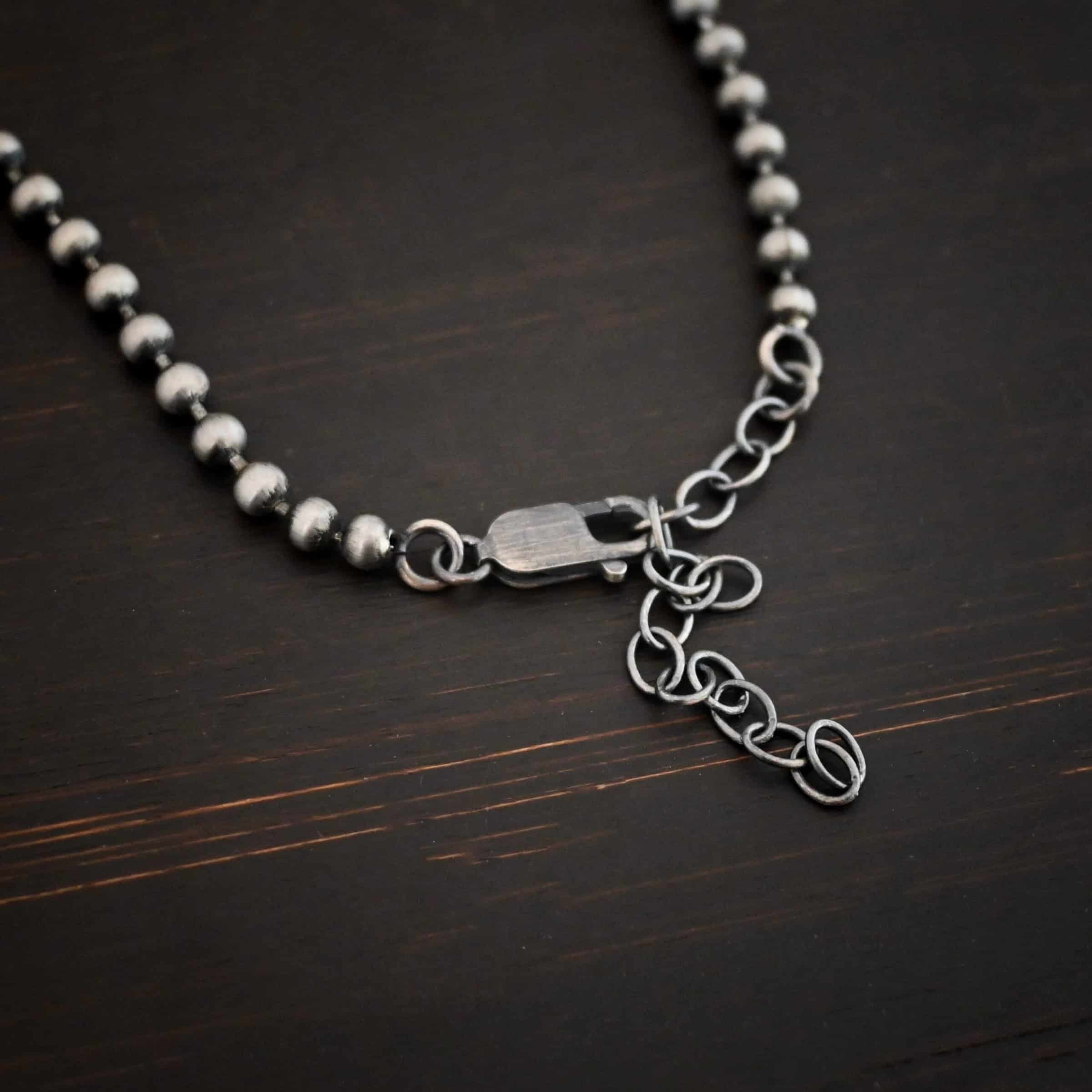 Stainless Steel Beau Ball chain shown on dark background