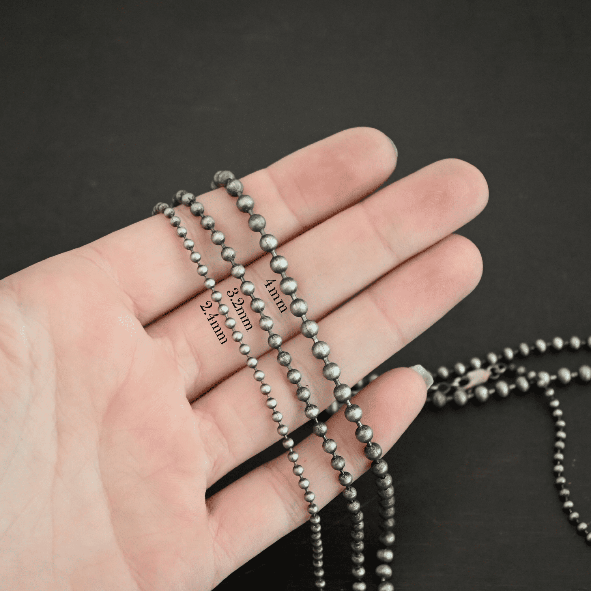 Stainless Steel Beau Ball chain shown on dark background