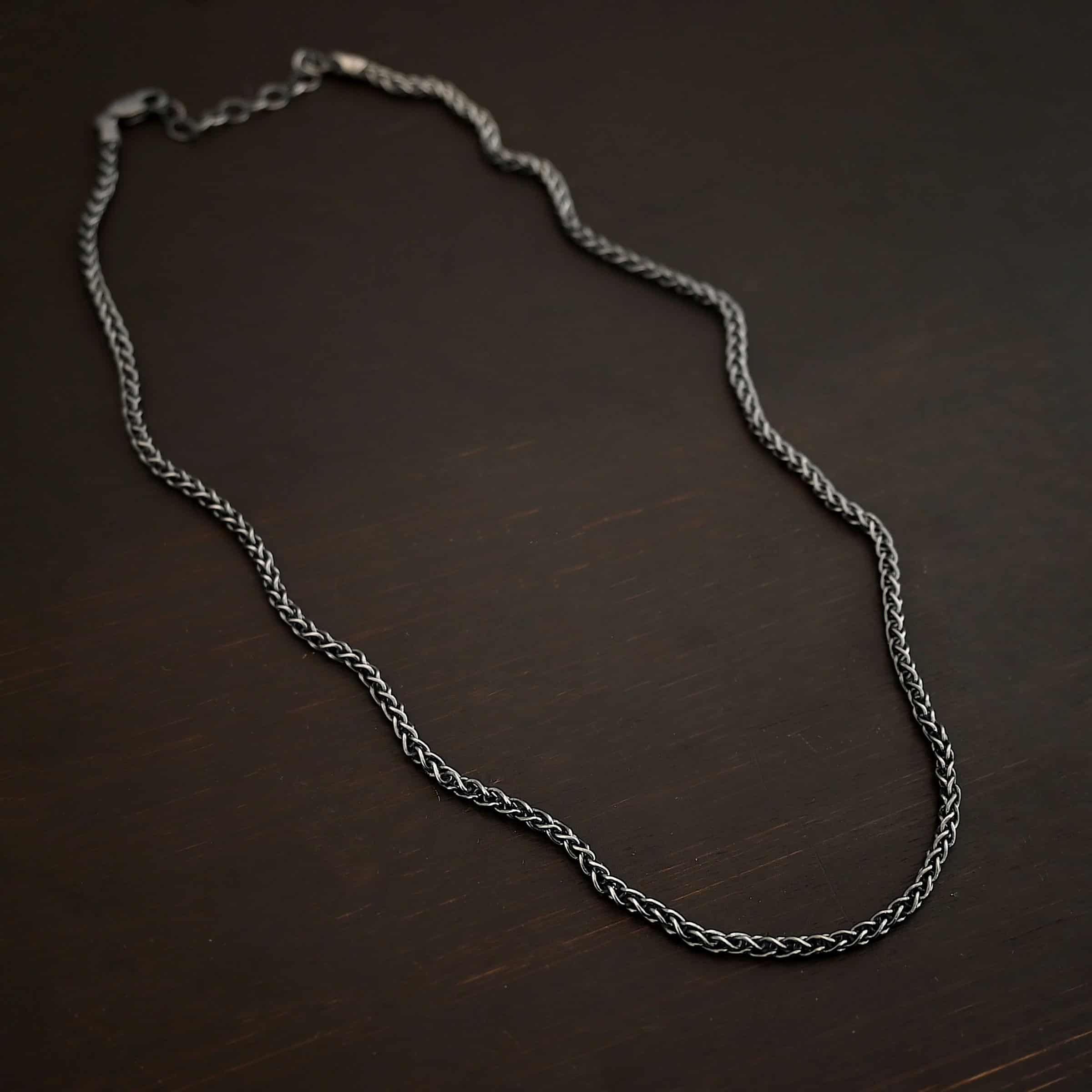 Frenchie chain - sterling silver Woven chain shown on dark background