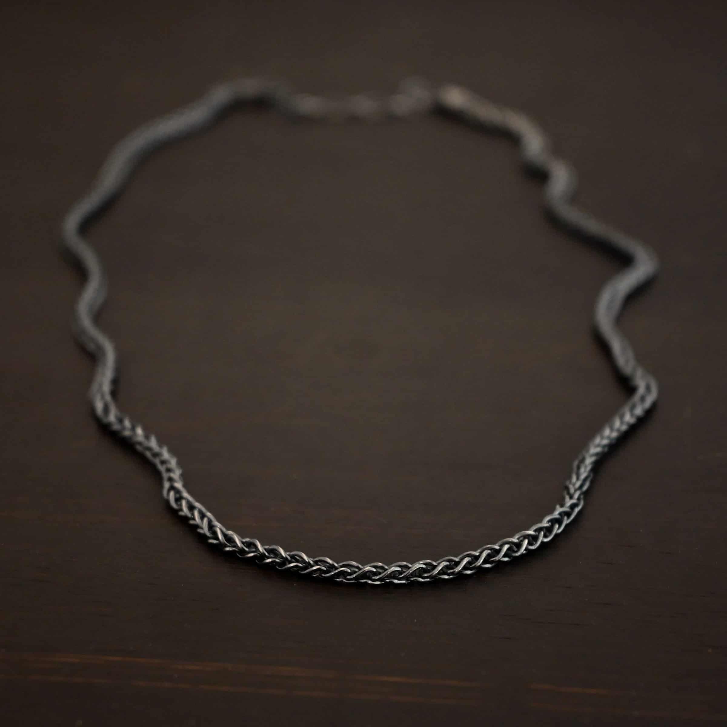 Frenchie chain - sterling silver Woven chain shown on dark background