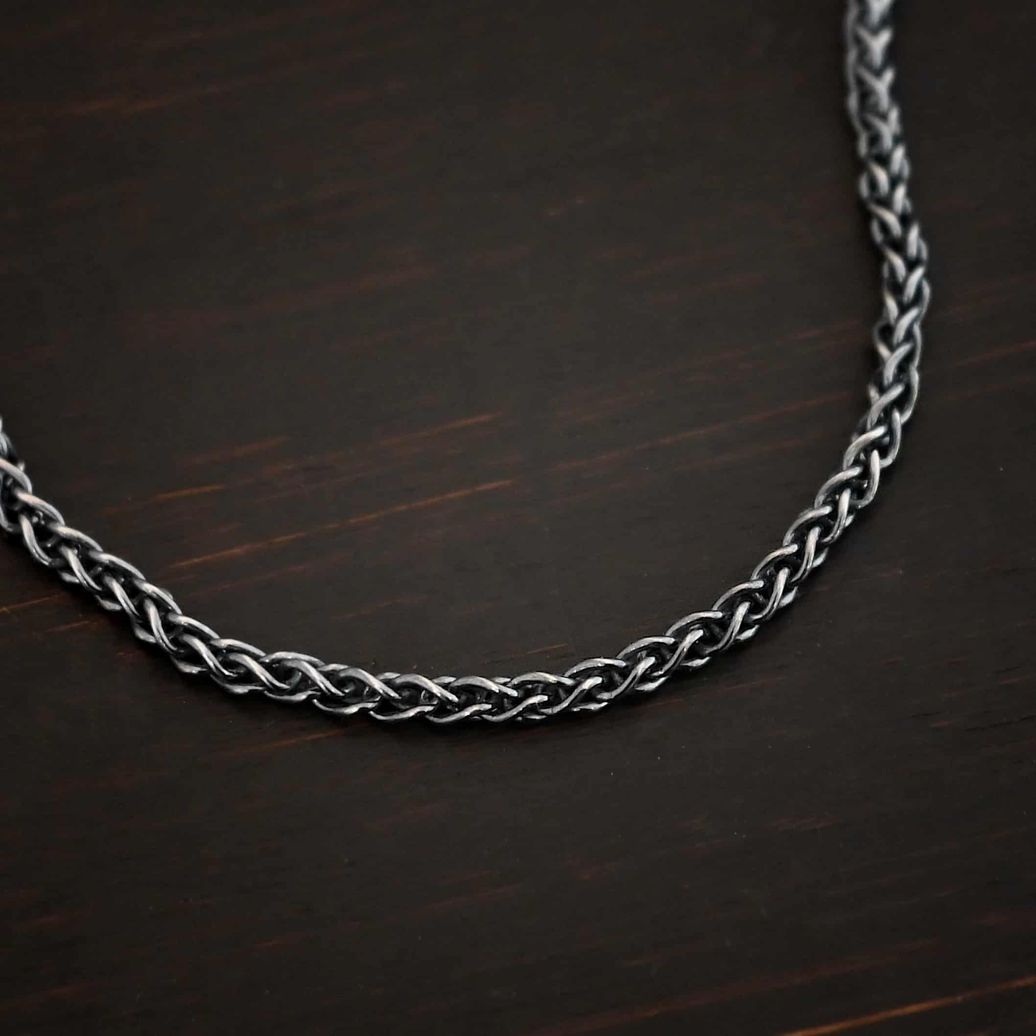 Frenchie chain - sterling silver Woven chain shown on dark background