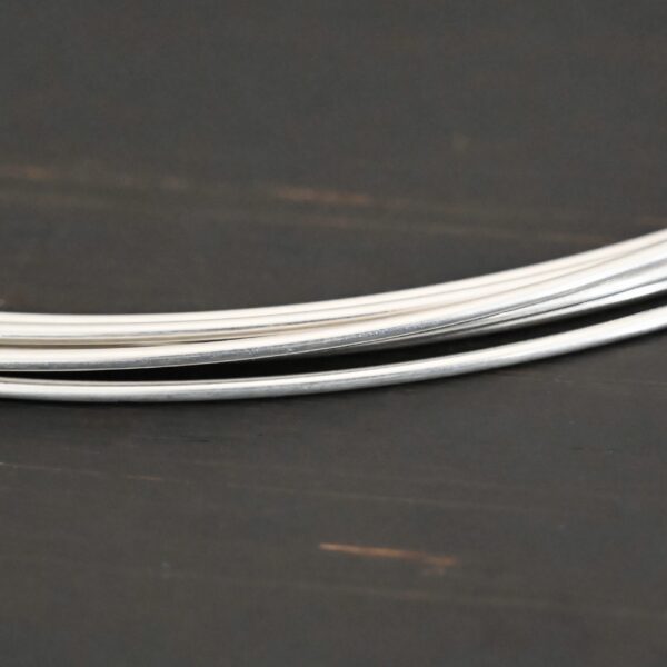 Silver Round Wire shown on dark background
