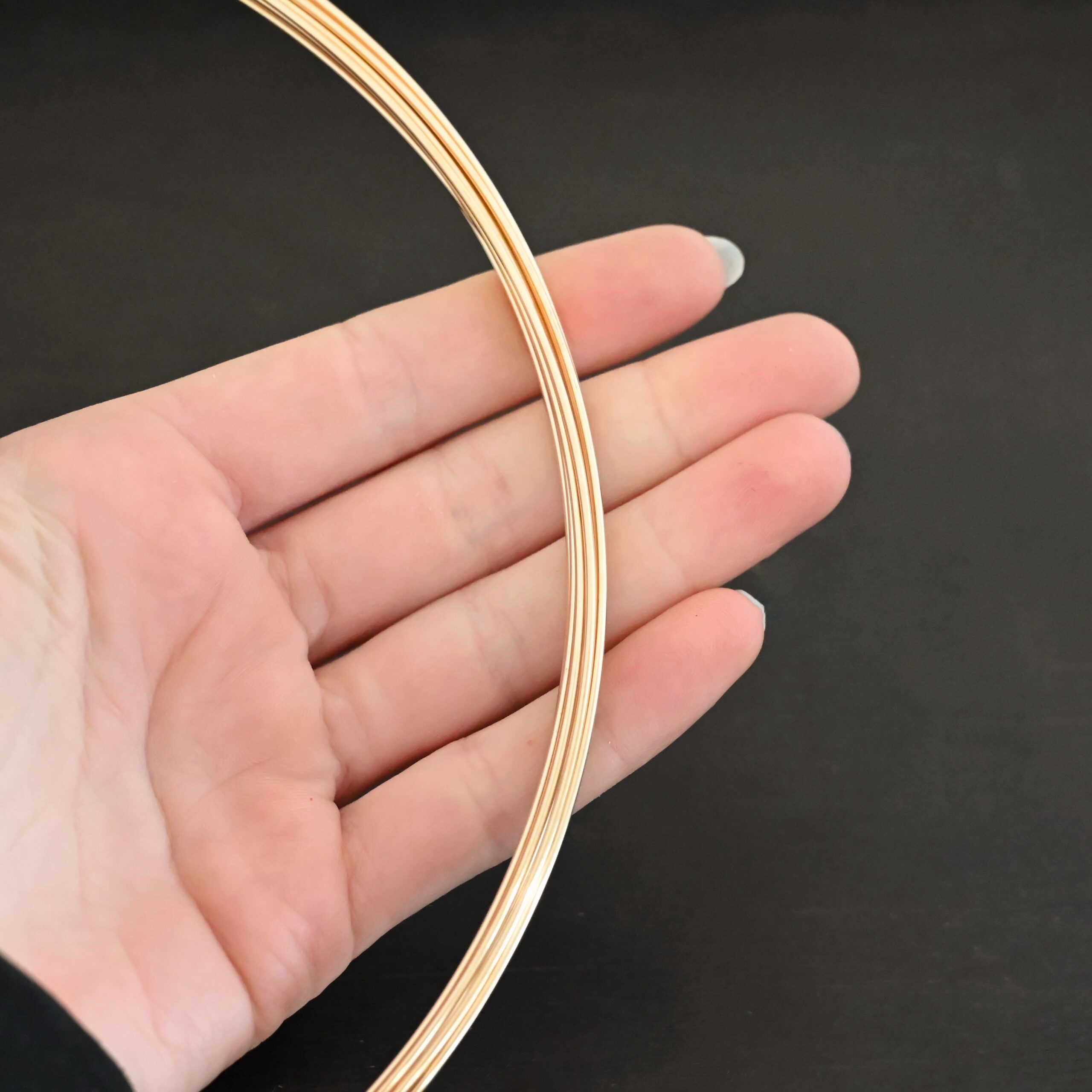 Gold Filled Round Wire shown in hand