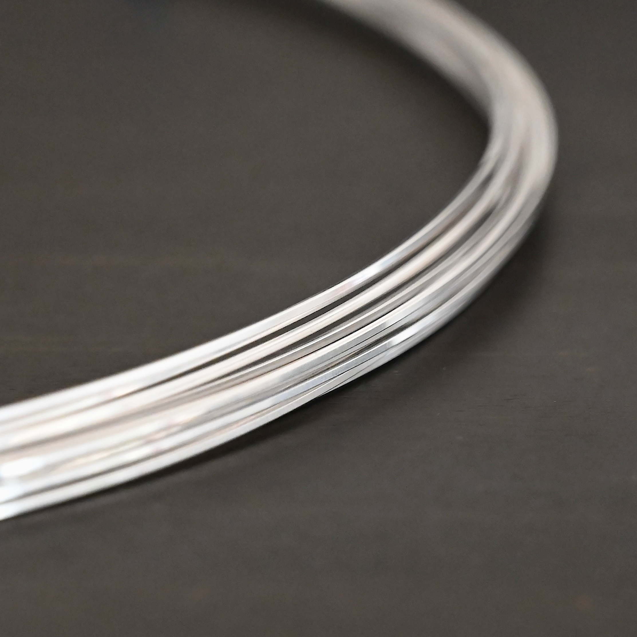 Sterling Silver Square Wire on dark background