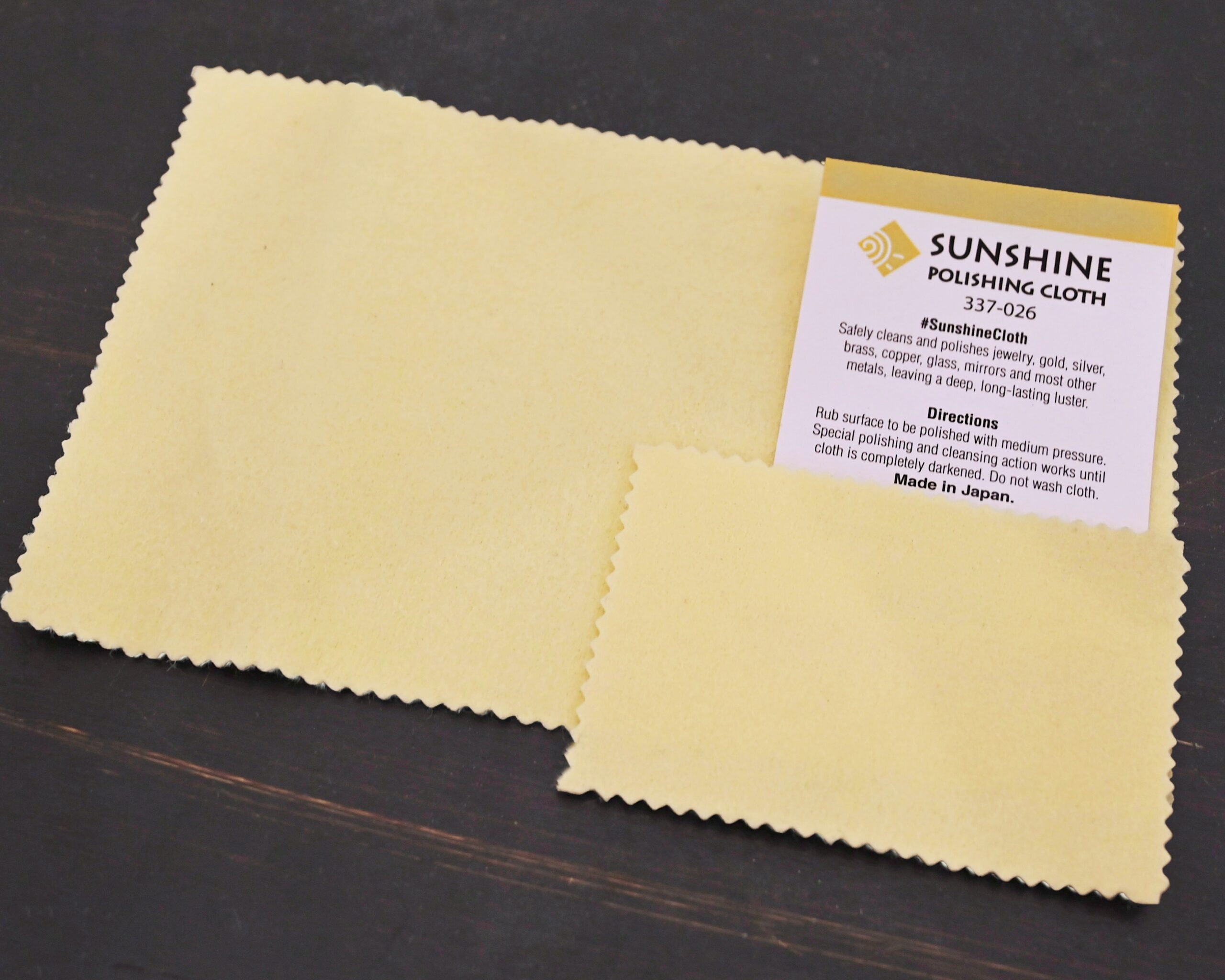 Yellow Jewelry Cleaning Cloth both sizes shown on dark background