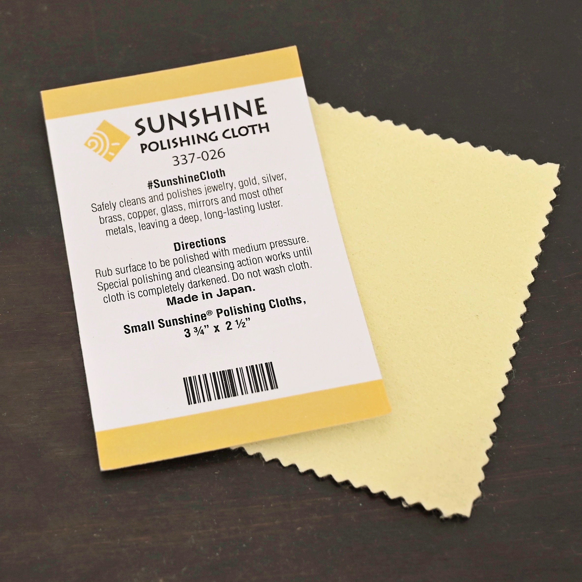 Yellow Jewelry small Cleaning Cloth shown on dark background