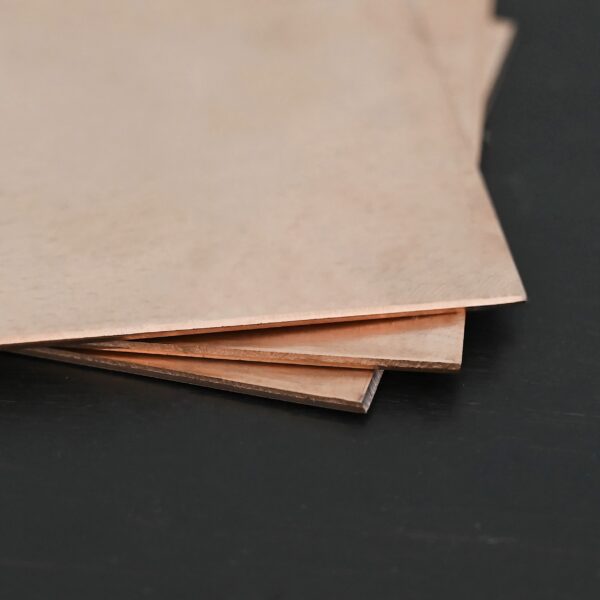3 Copper square sheets shown on dark background