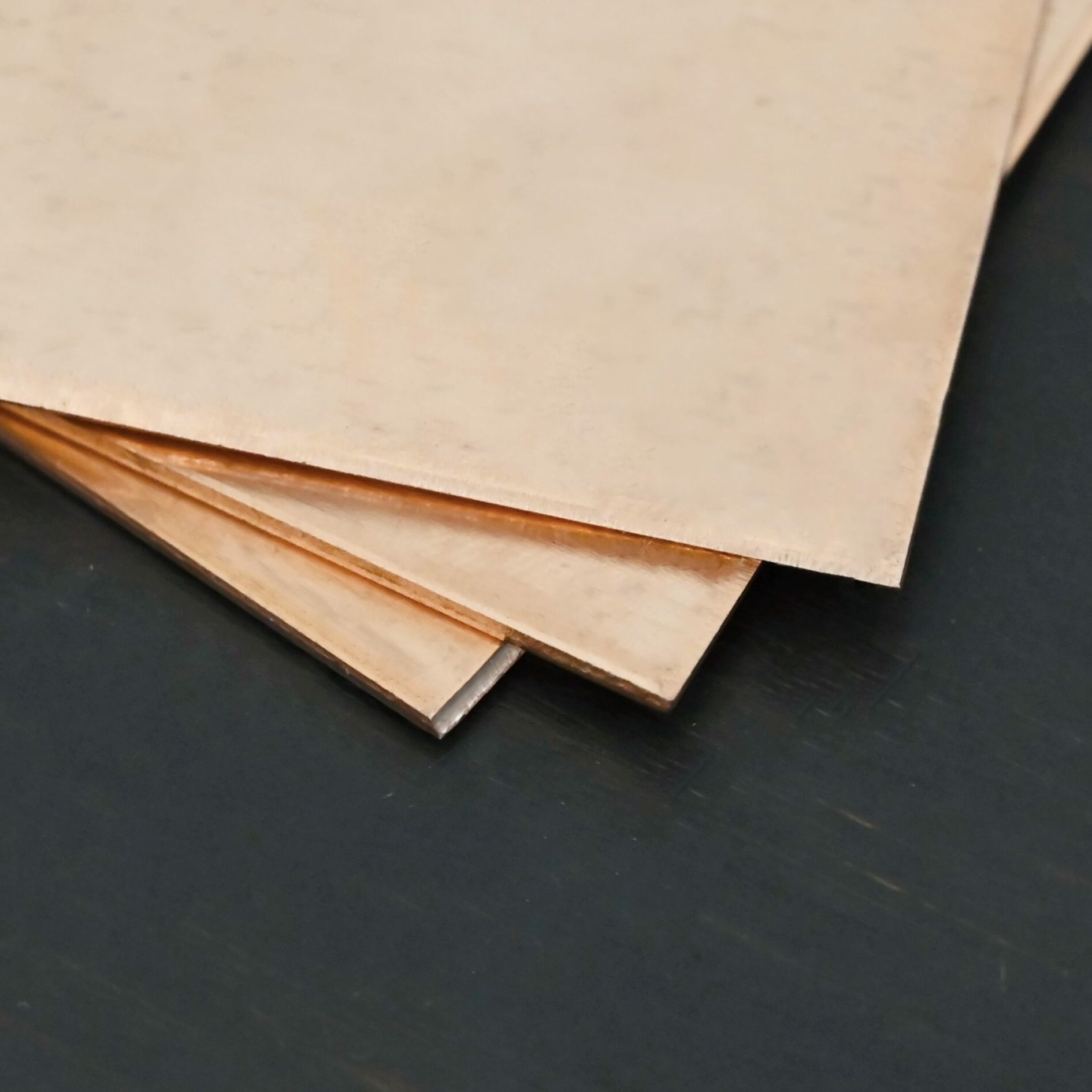 Copper Sheet 3 Copper 3x3" square sheets shown on dark background