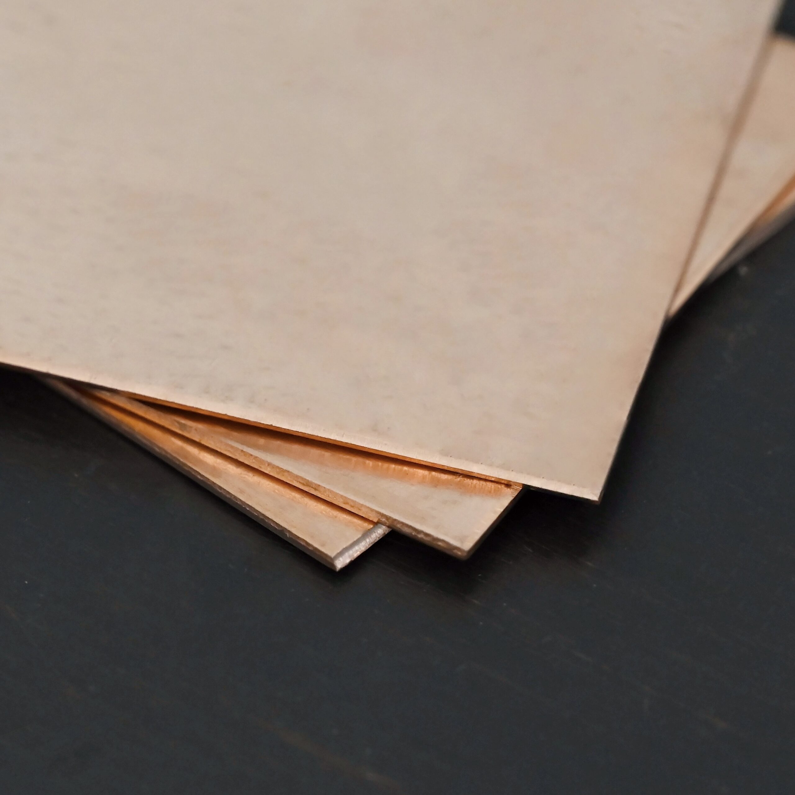 Copper Sheet 3 Copper 3x3" square sheets shown on dark background