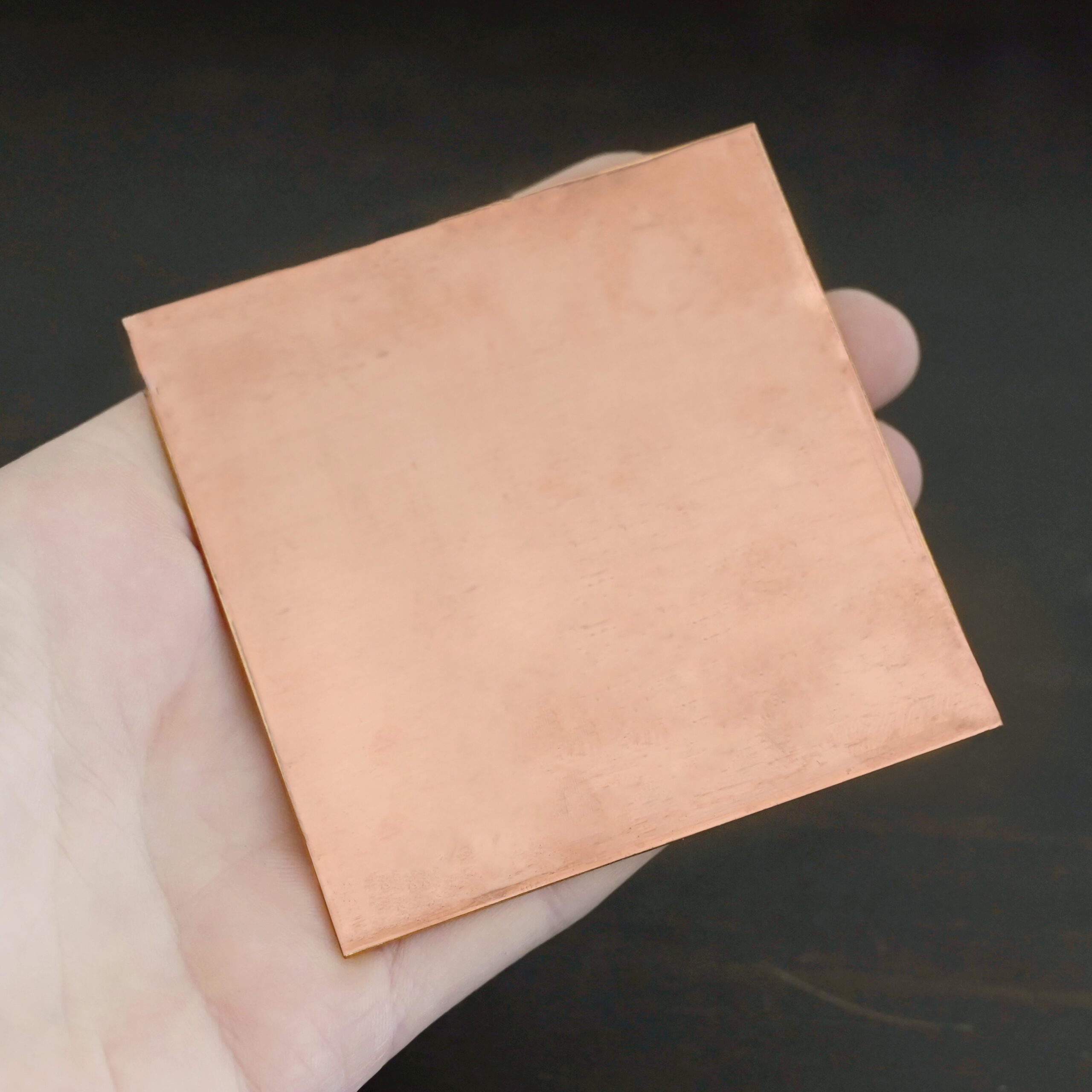 Copper Sheet 3x3" copper square sheets shown in hand