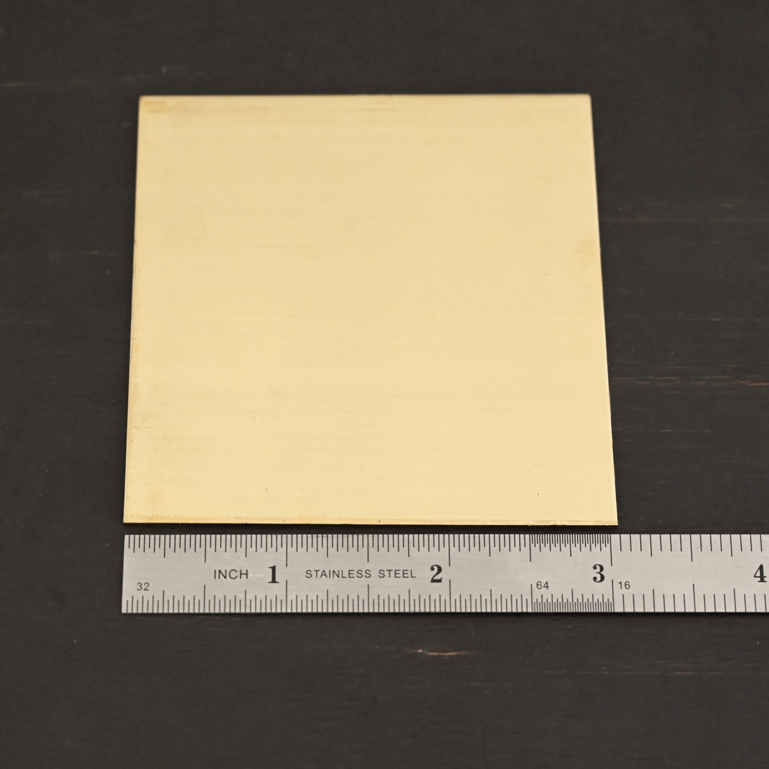 3x3" brass square sheets shown by ruler