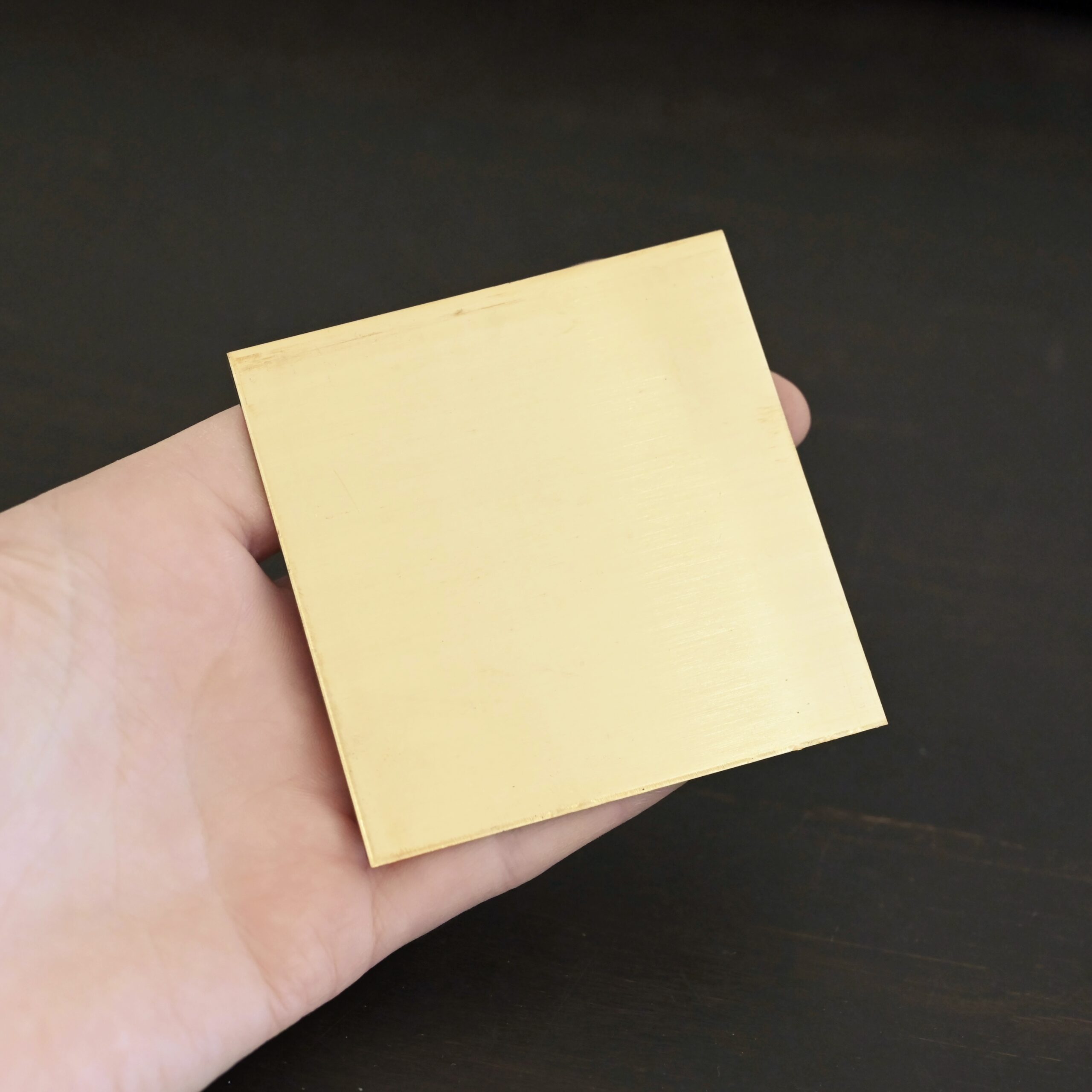 3x3" brass square sheets shown in hand