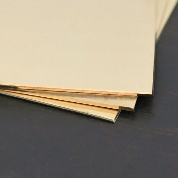 3- 3x3" brass square sheets shown on dark background