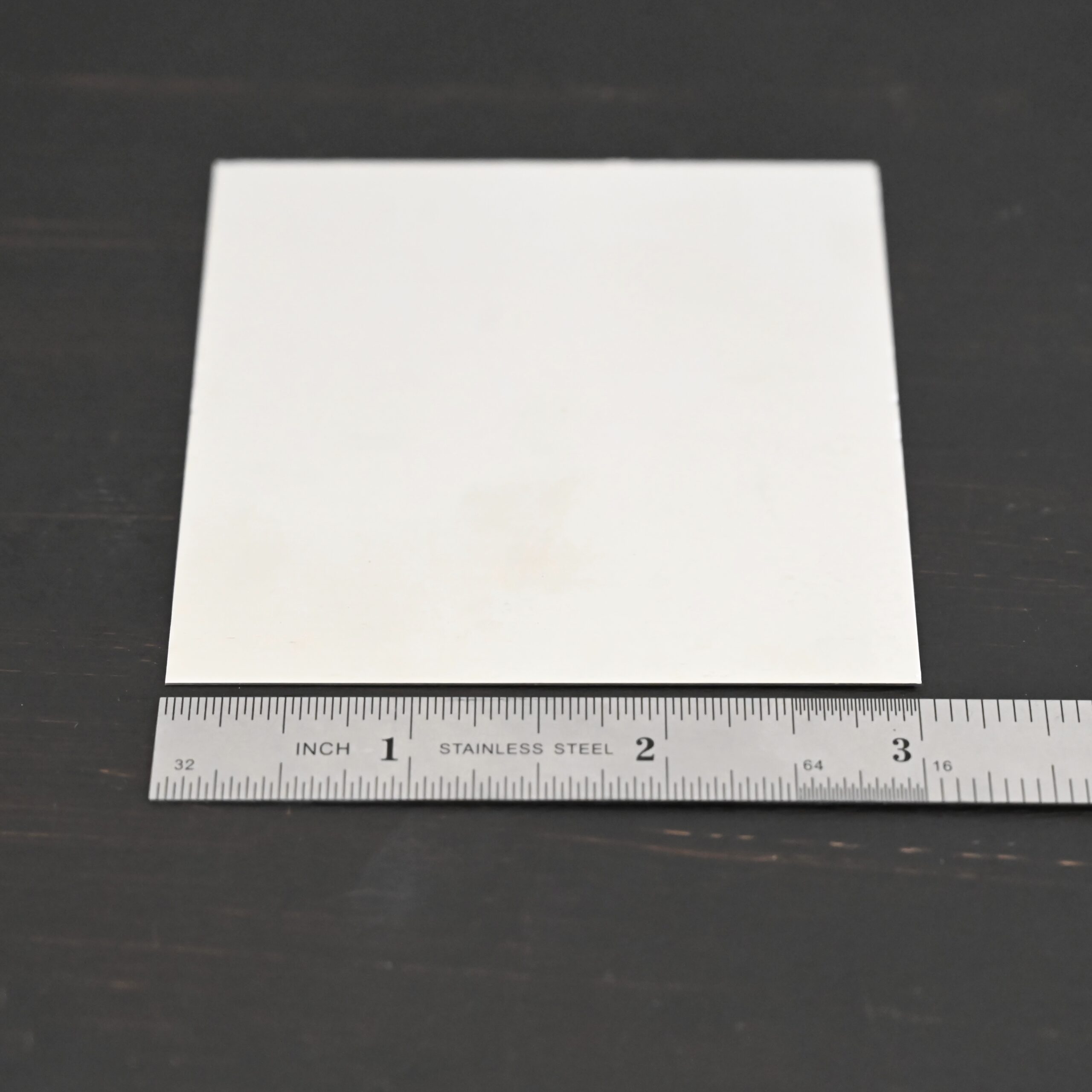 3"x3" silver square sheets shown by ruler
