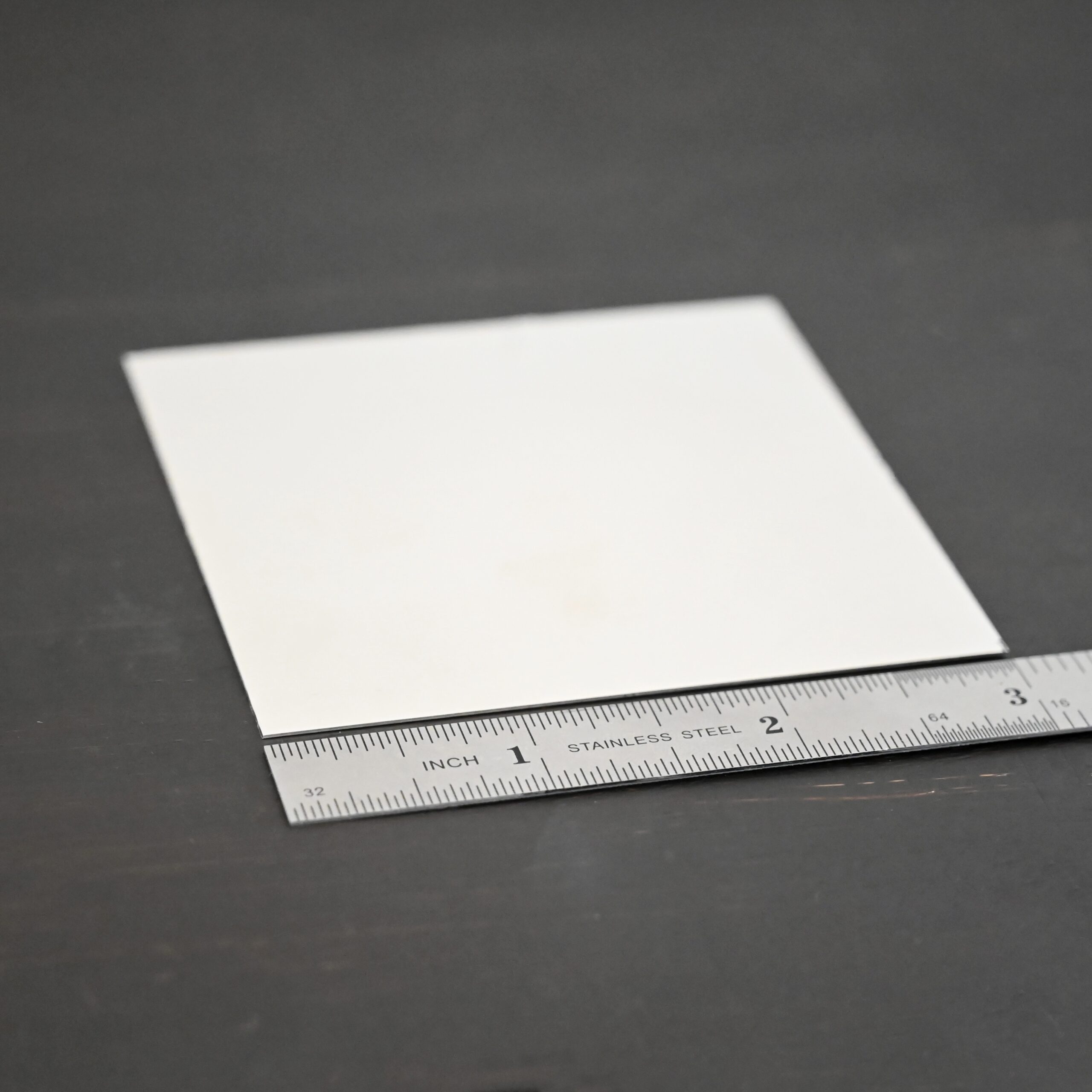 3"x3" silver square sheets shown by ruler