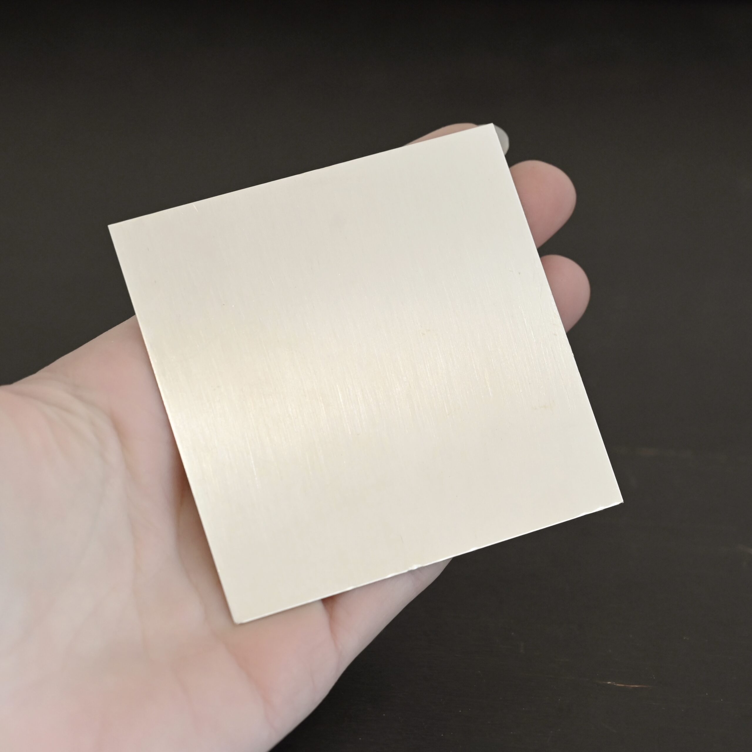 3"x3" silver square sheet shown in hand