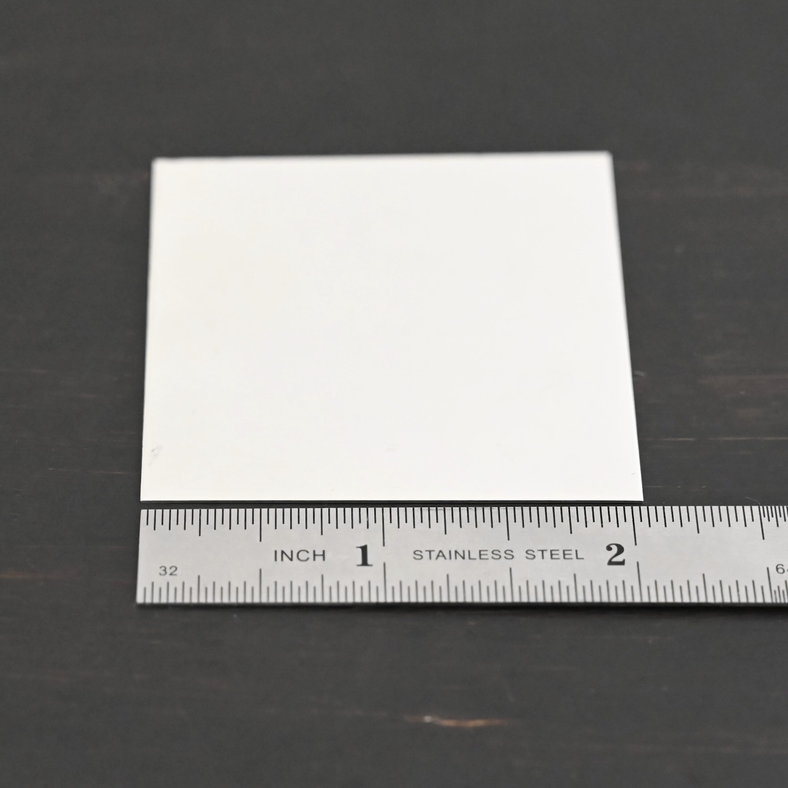 2"x2" silver square sheet shown by ruler