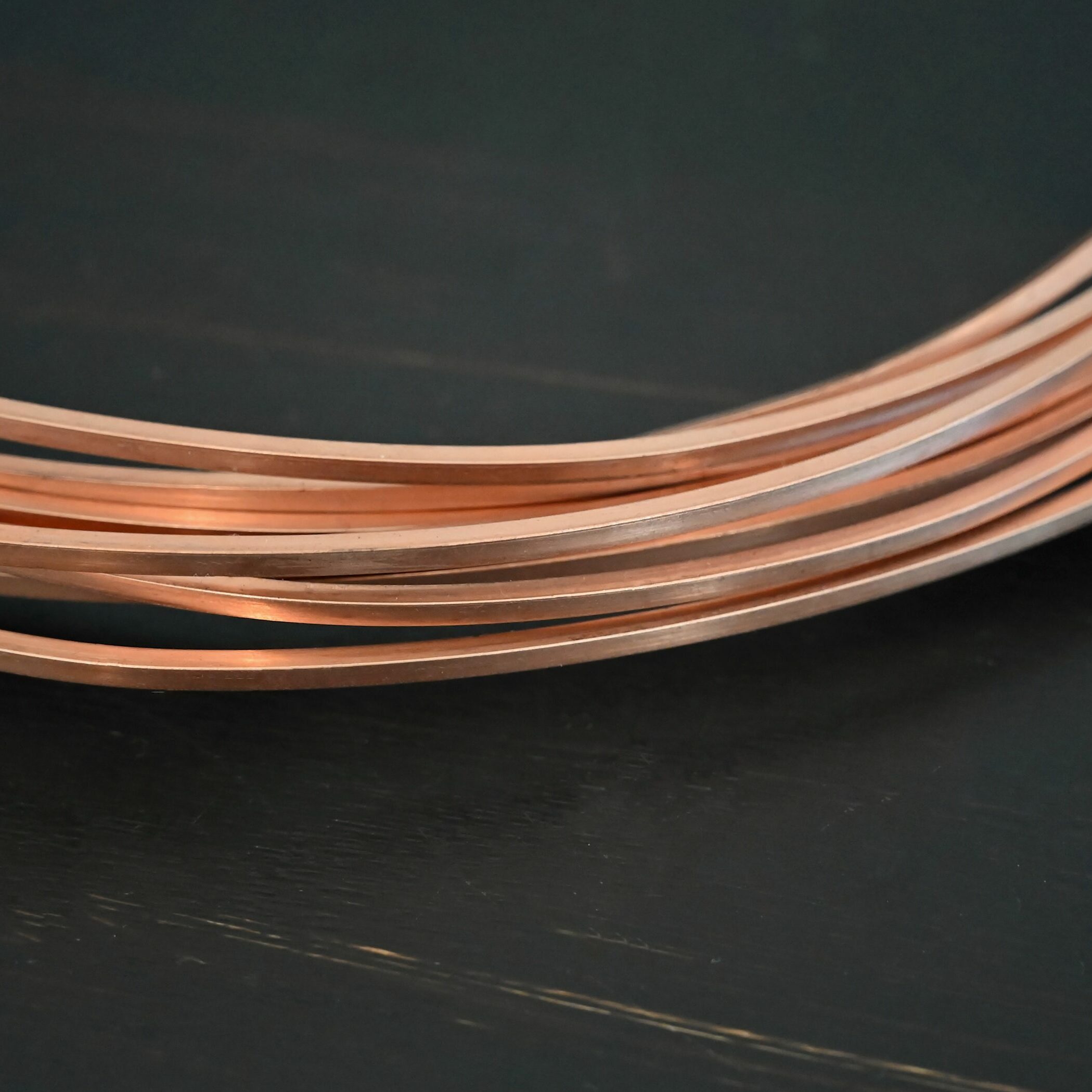 Copper Square Wire Copper Square Wire shown on dark background