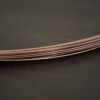 Copper Solder Wire shown on dark background