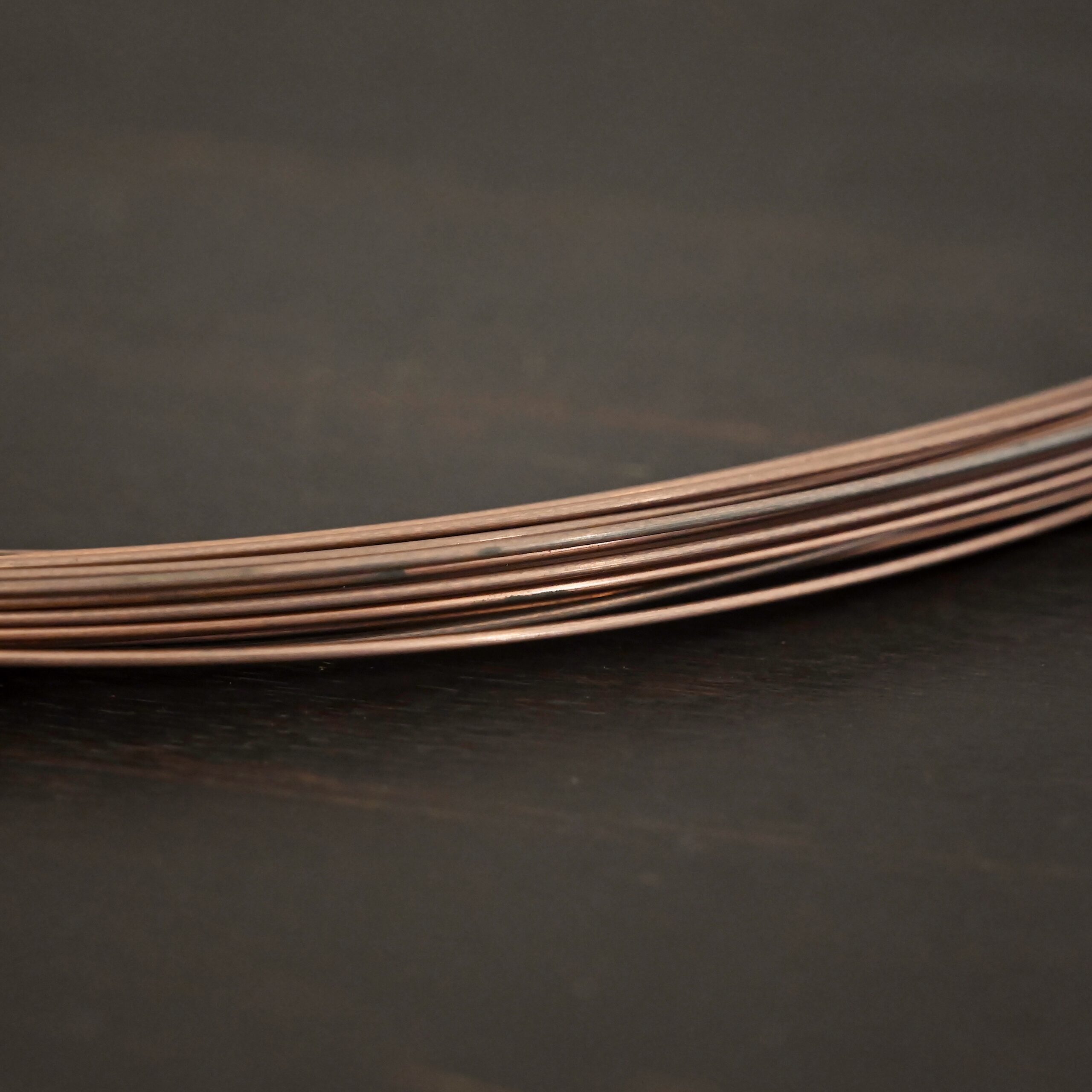 Copper Solder Wire shown on dark background