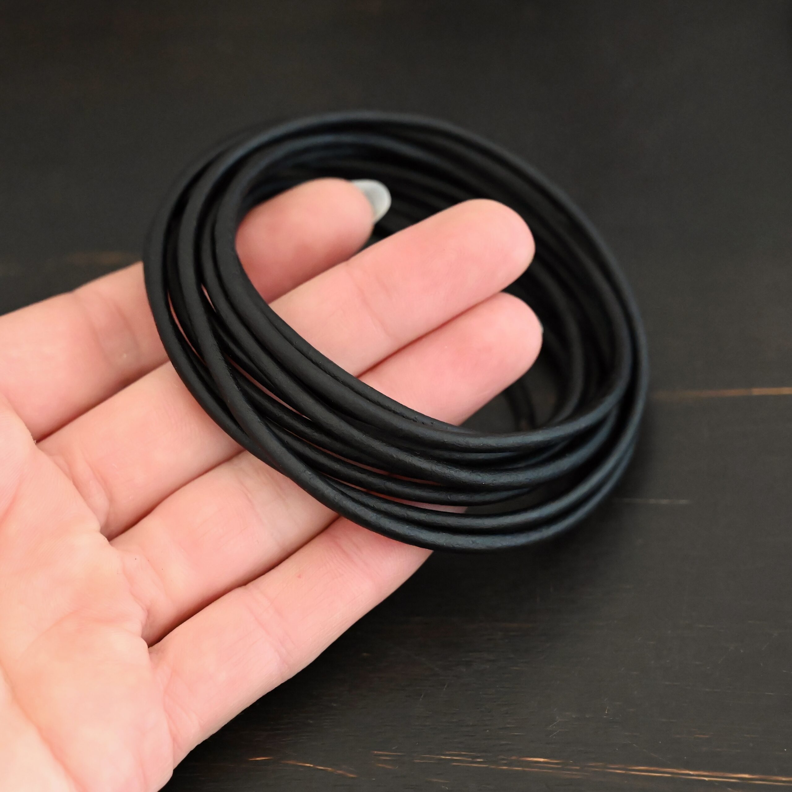 Genuine Natural 3mm black leather in hand