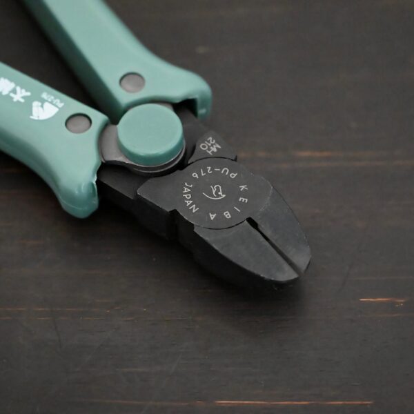 Power Max Full Flush Cutting Pliers - Turquoise plastic handle shown on dark background