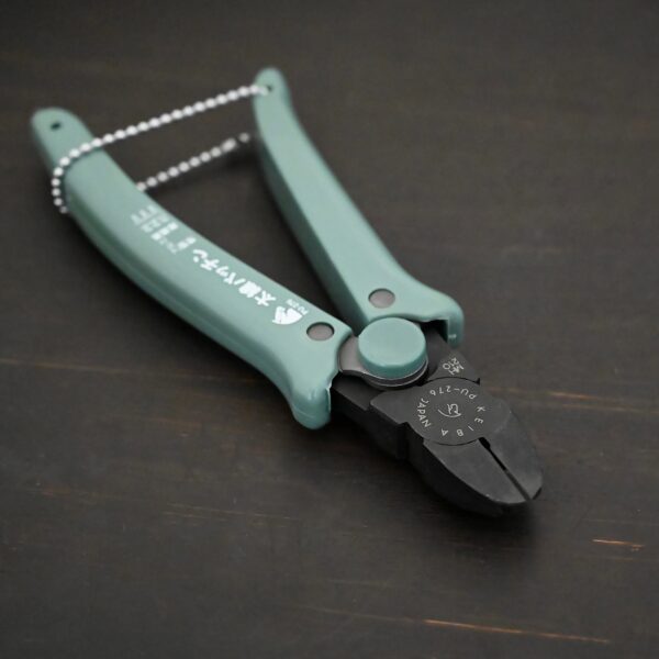 Power Max Full Flush Cutting Pliers - Turquoise plastic handle shown on dark background