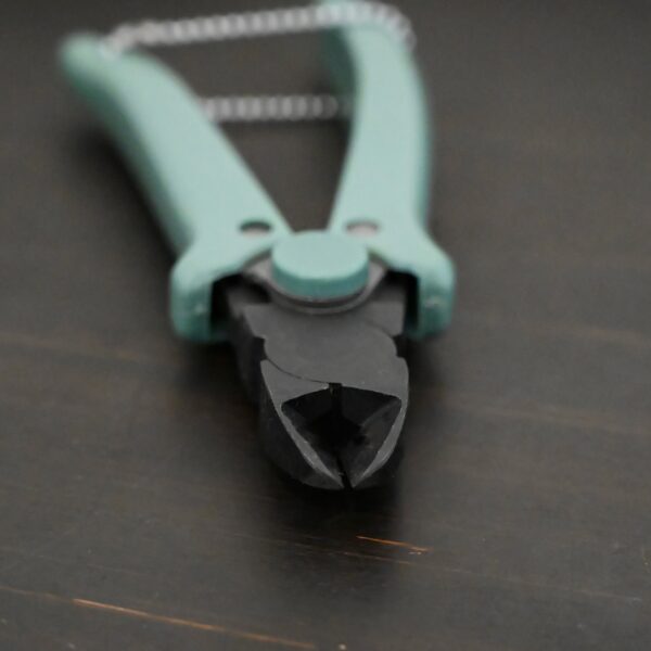 Power Max Full Flush Cutting Pliers - Turquoise plastic handle shown on dark background