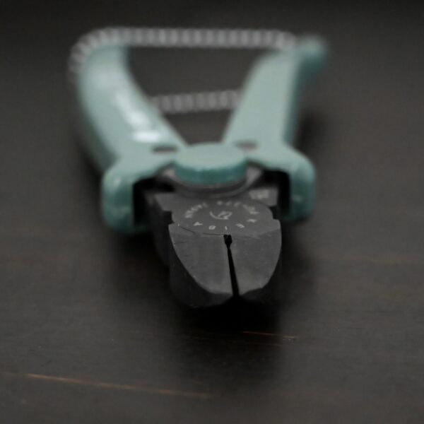 Power Max Full Flush Cutting Pliers - Turquoise plastic handle shown on dark background