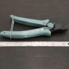 Power Max Full Flush Cutting Pliers - Turquoise plastic handle shown next to ruler